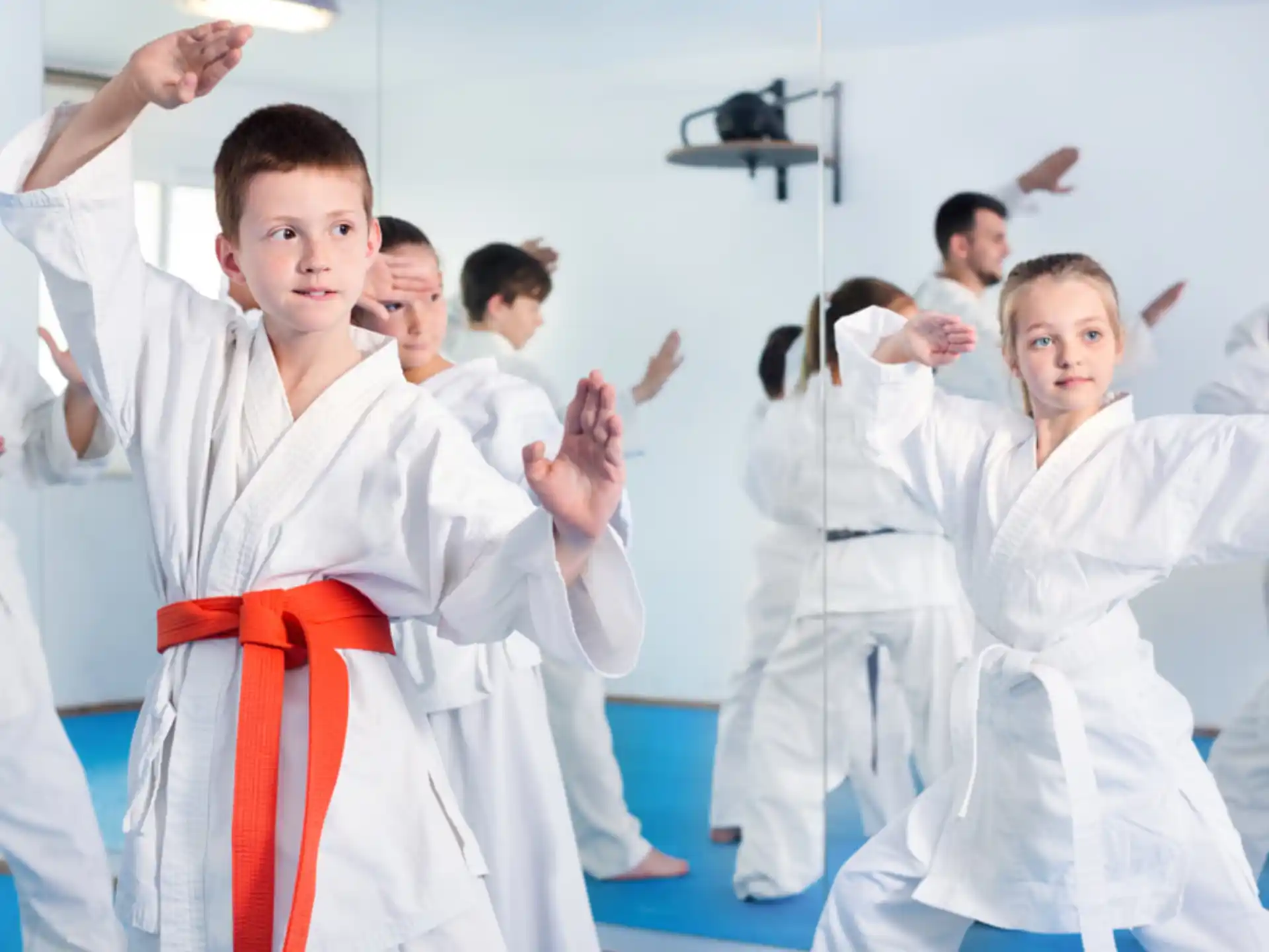 a group of people in karate uniforms