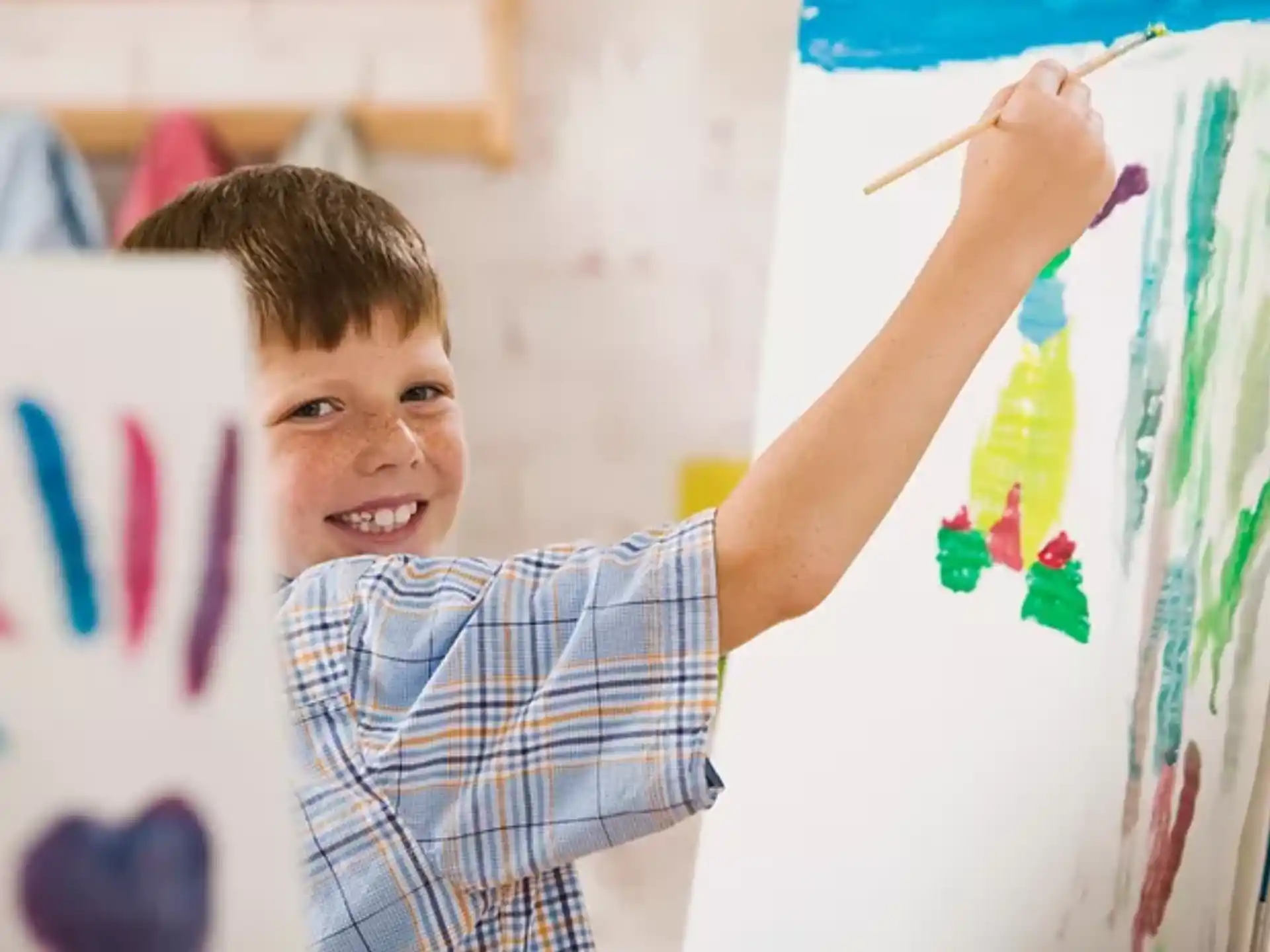 a young boy painting