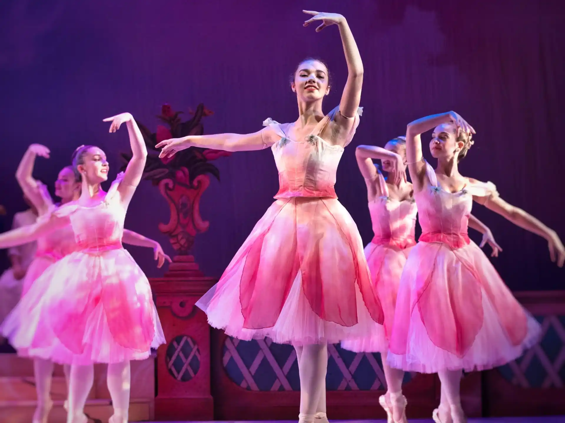 a group of women dancing on a stage