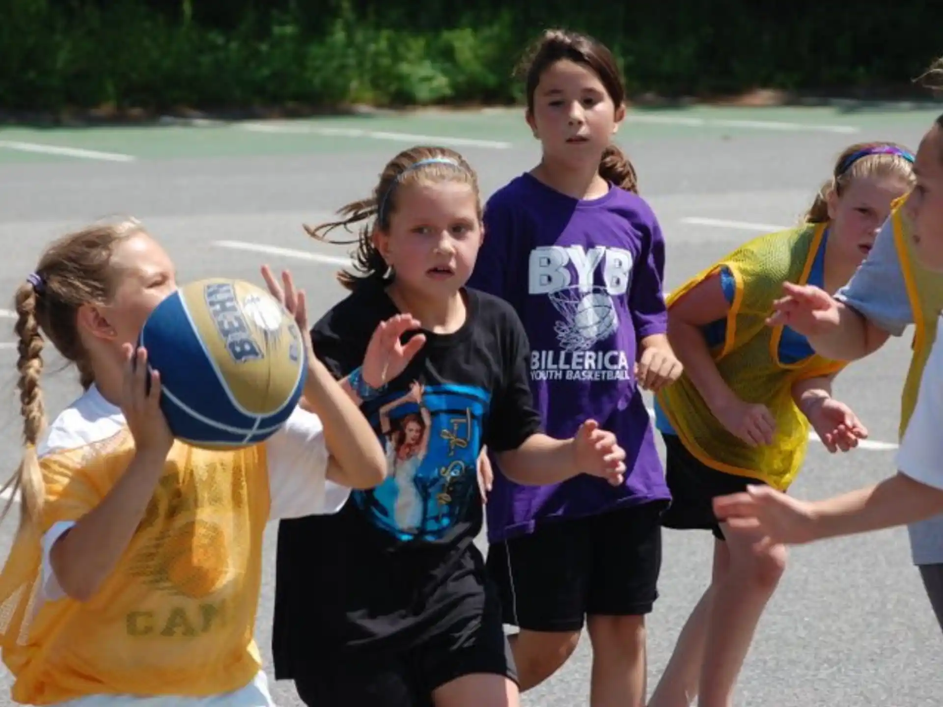 a group of girls playing volleyball