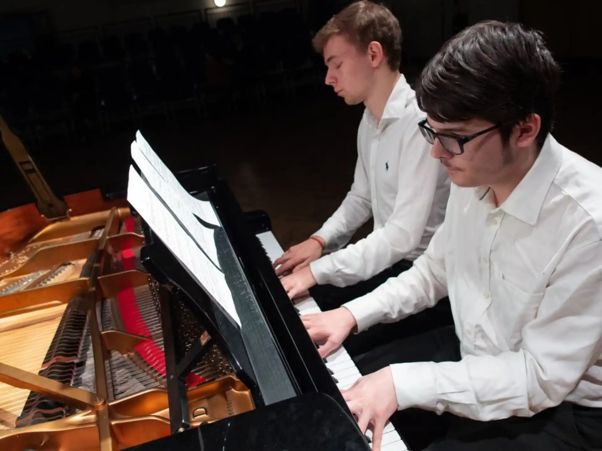 a couple of men playing musical instruments