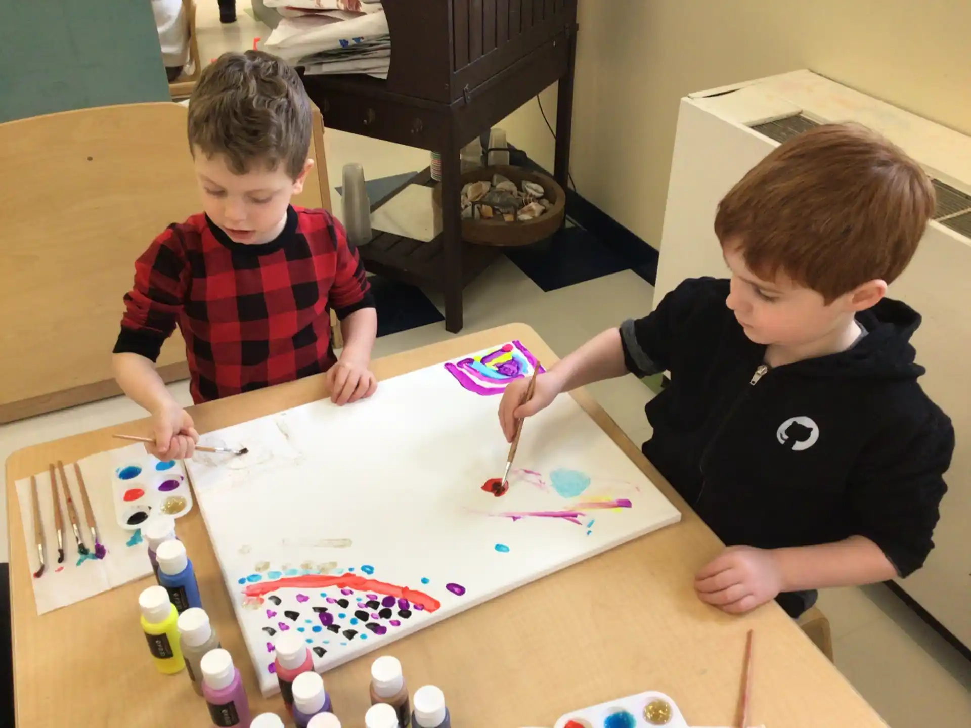 a couple of boys playing with toys