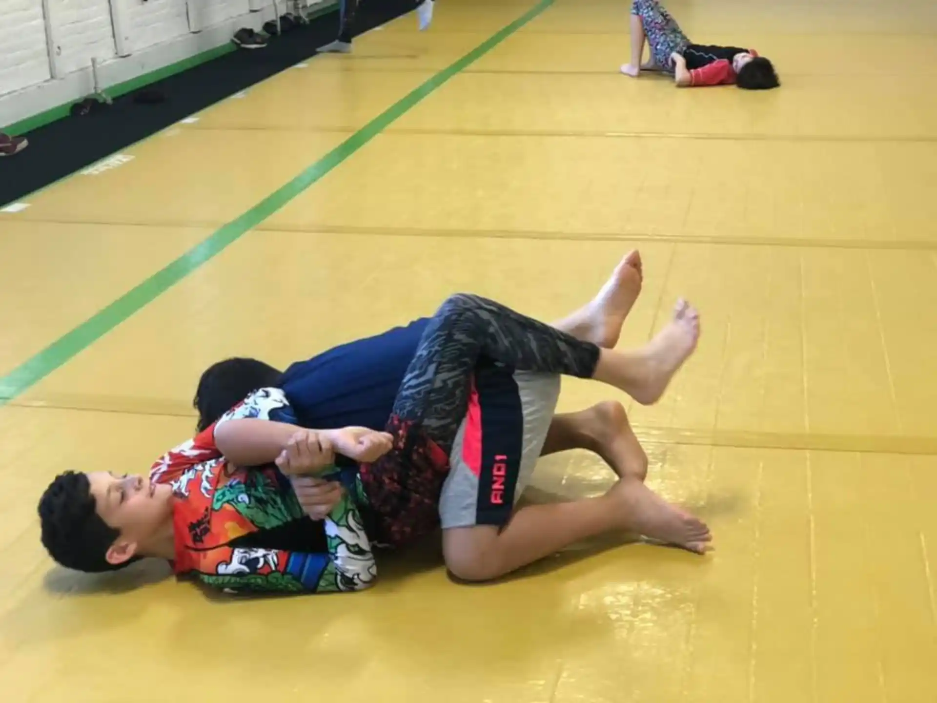 a couple of boys lying on the floor