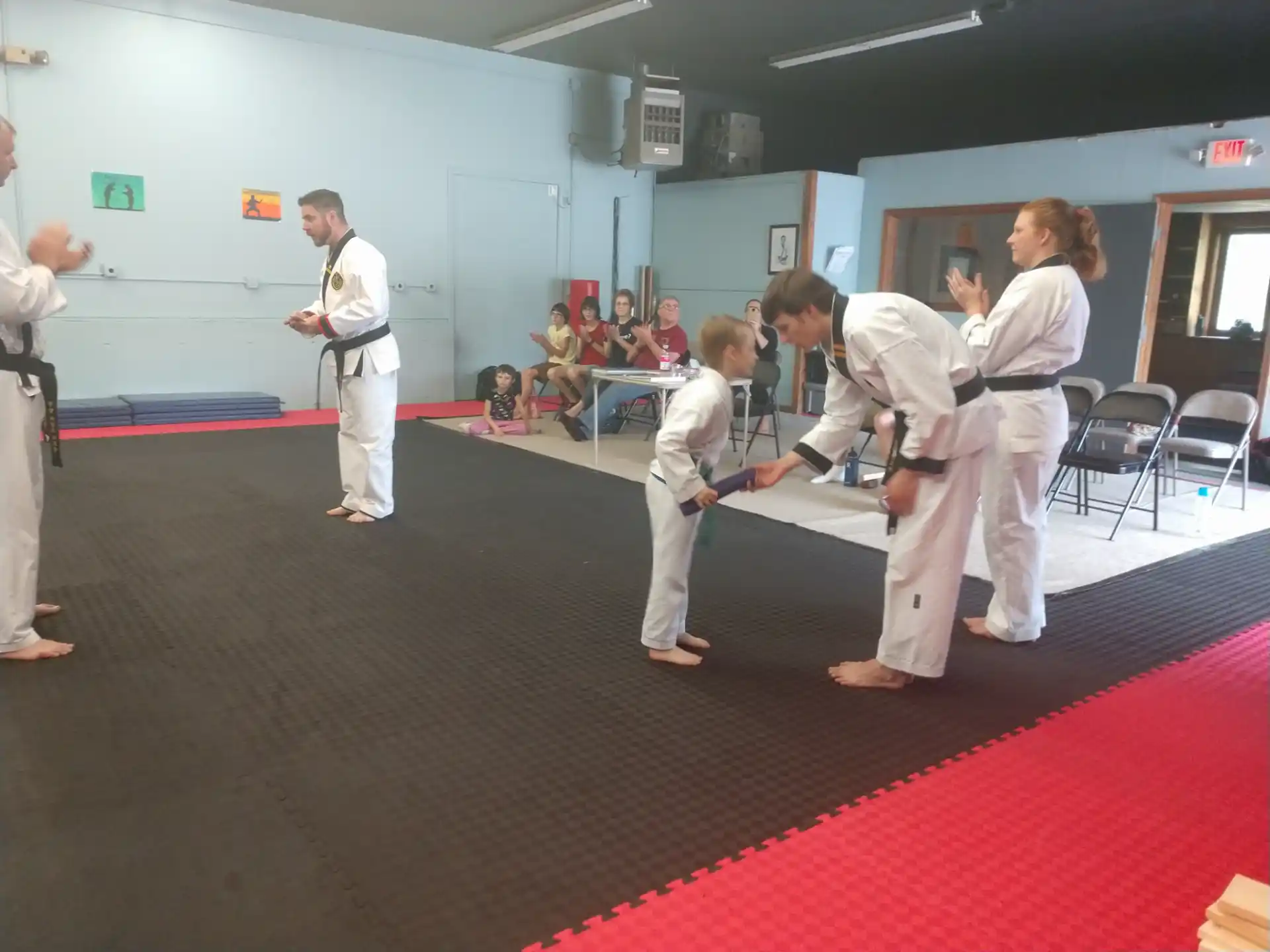 a group of people in karate uniforms