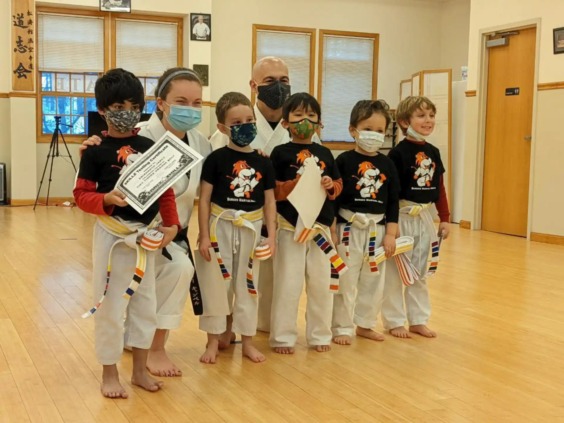 a group of kids wearing masks