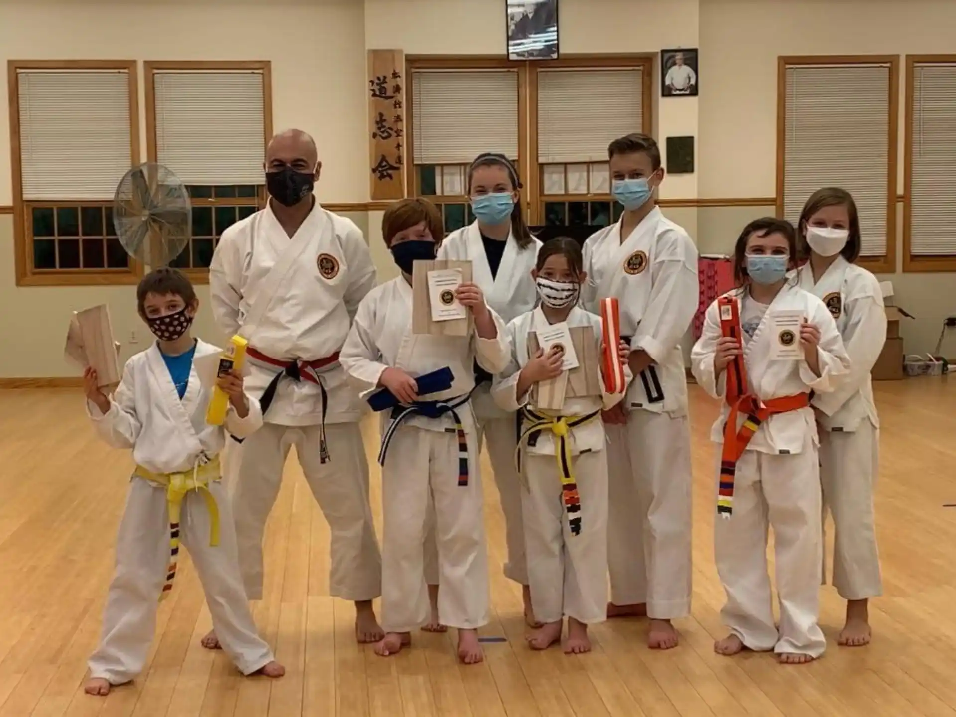 a group of people wearing white masks