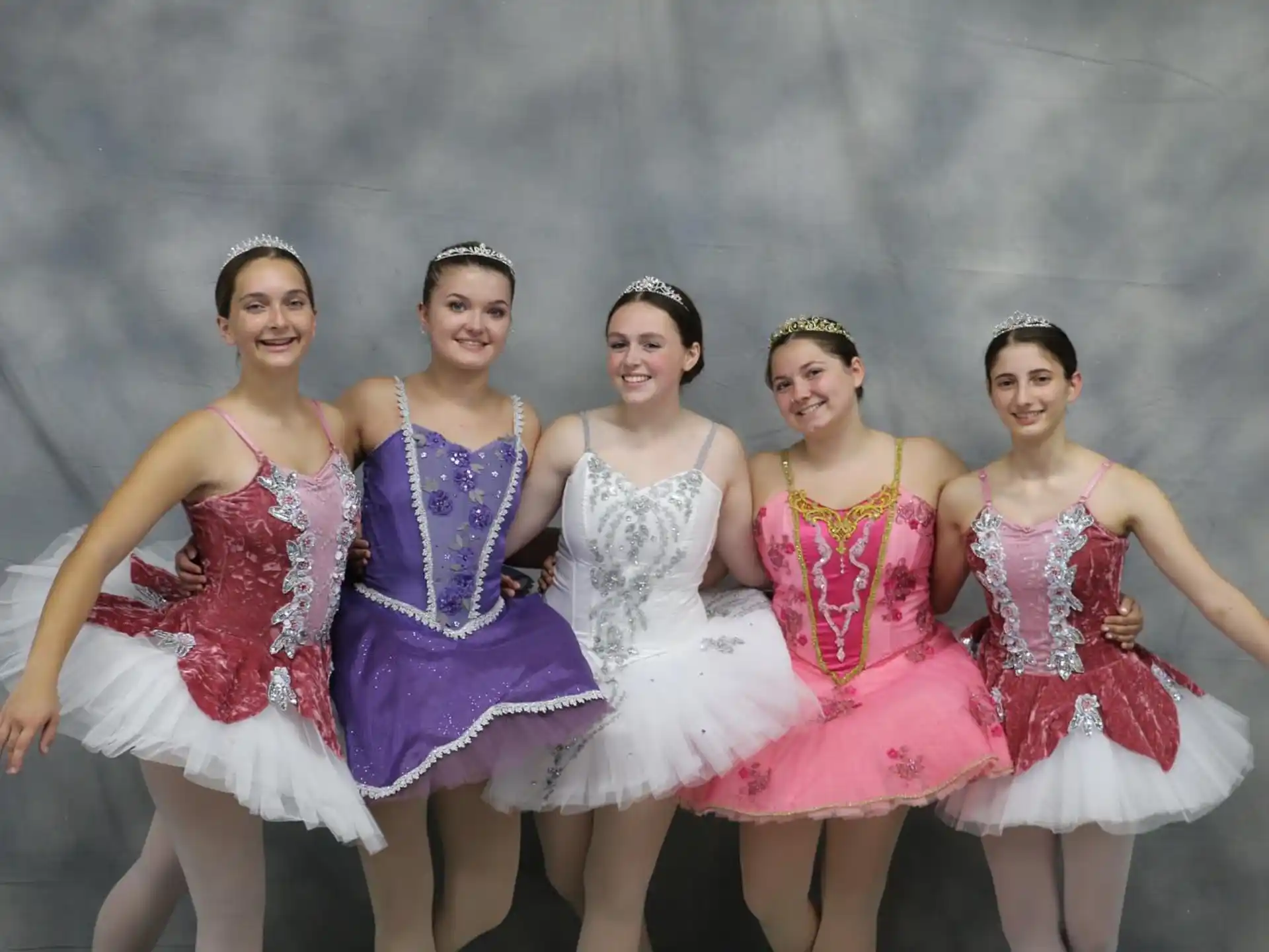 a group of women in dresses