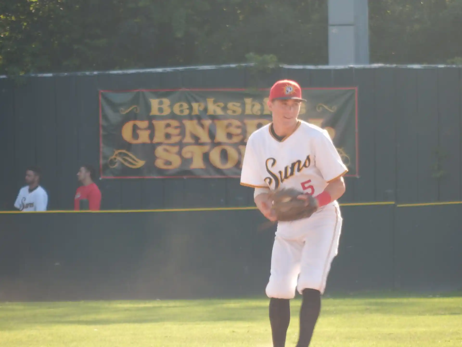 a baseball player in a red hat