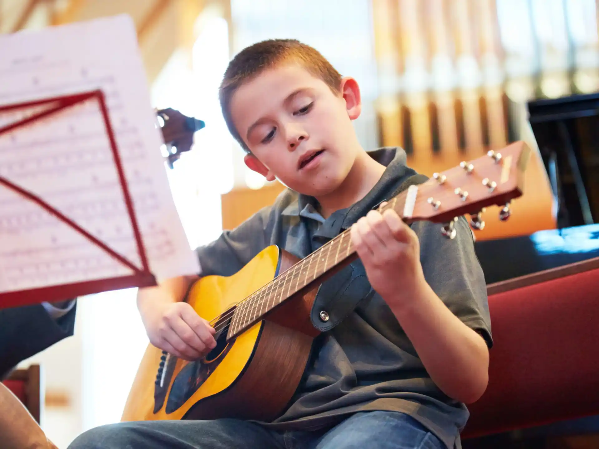 a boy playing a guitar