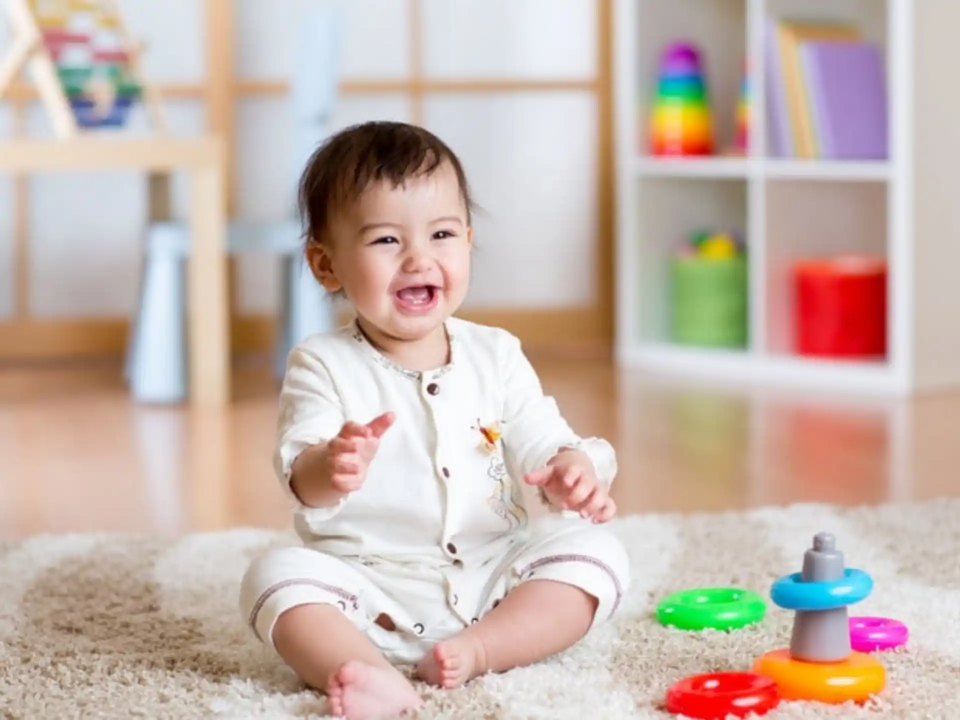 a baby sitting on the floor
