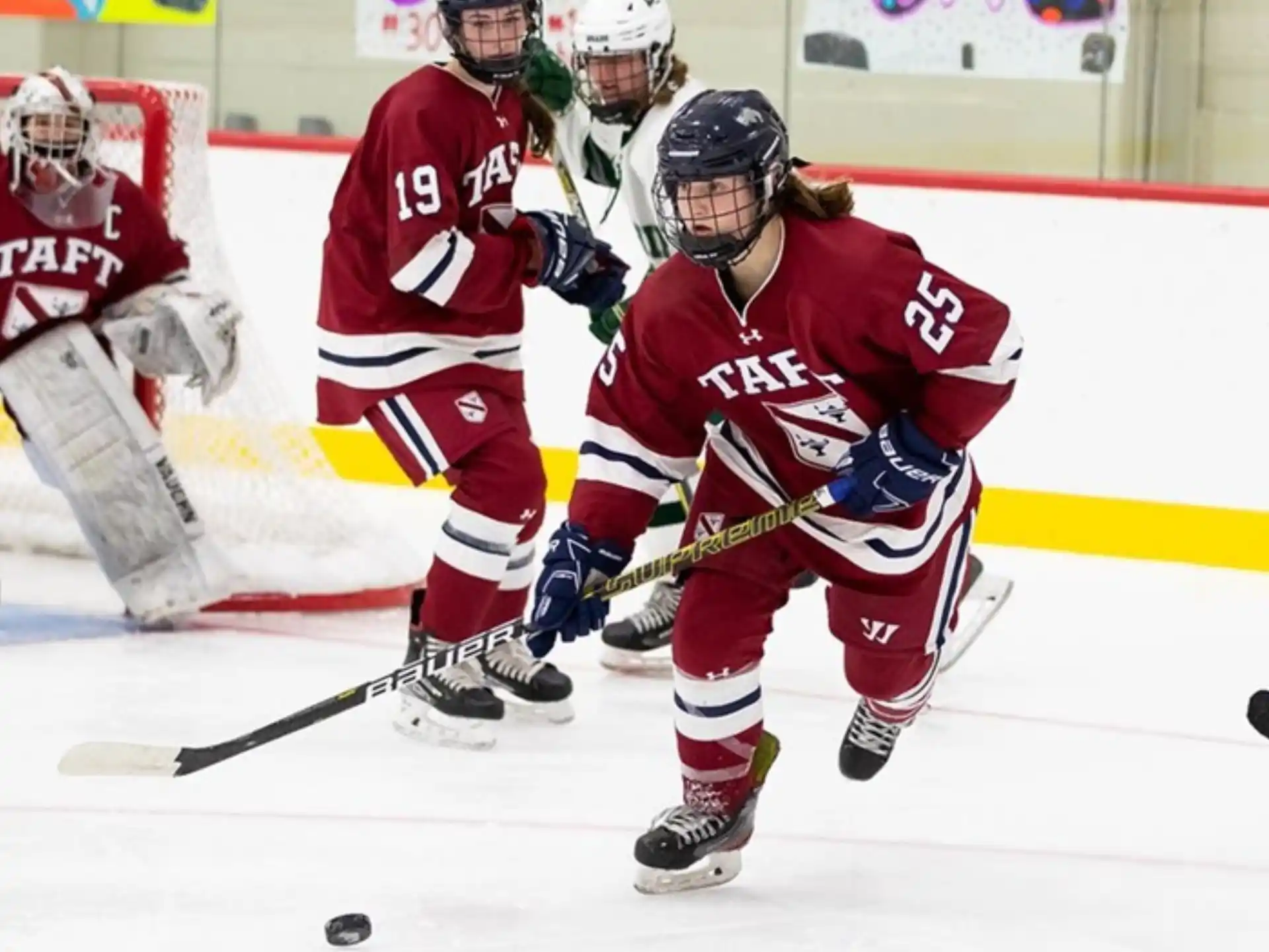 a group of people playing hockey
