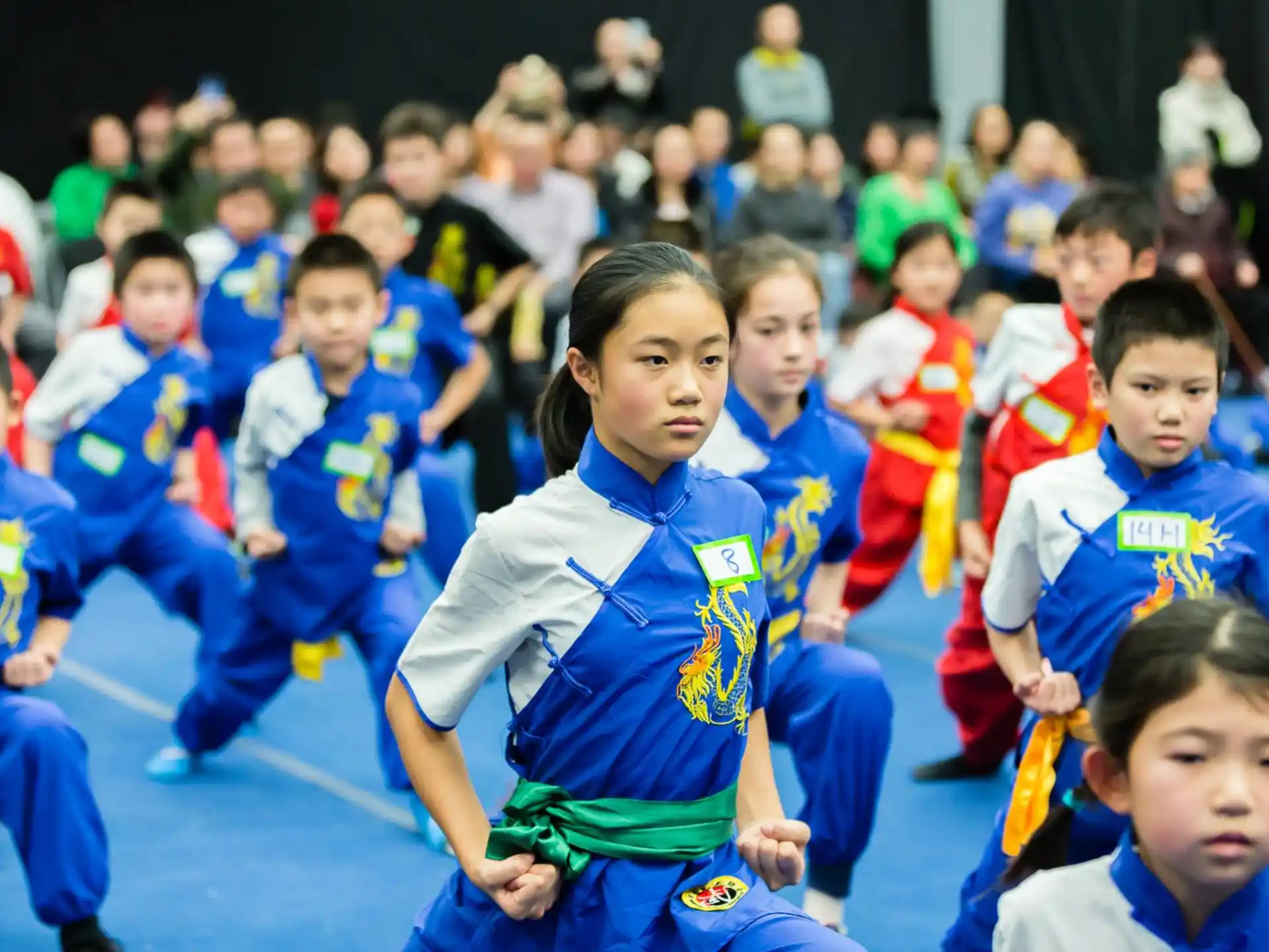 a group of children in blue uniforms