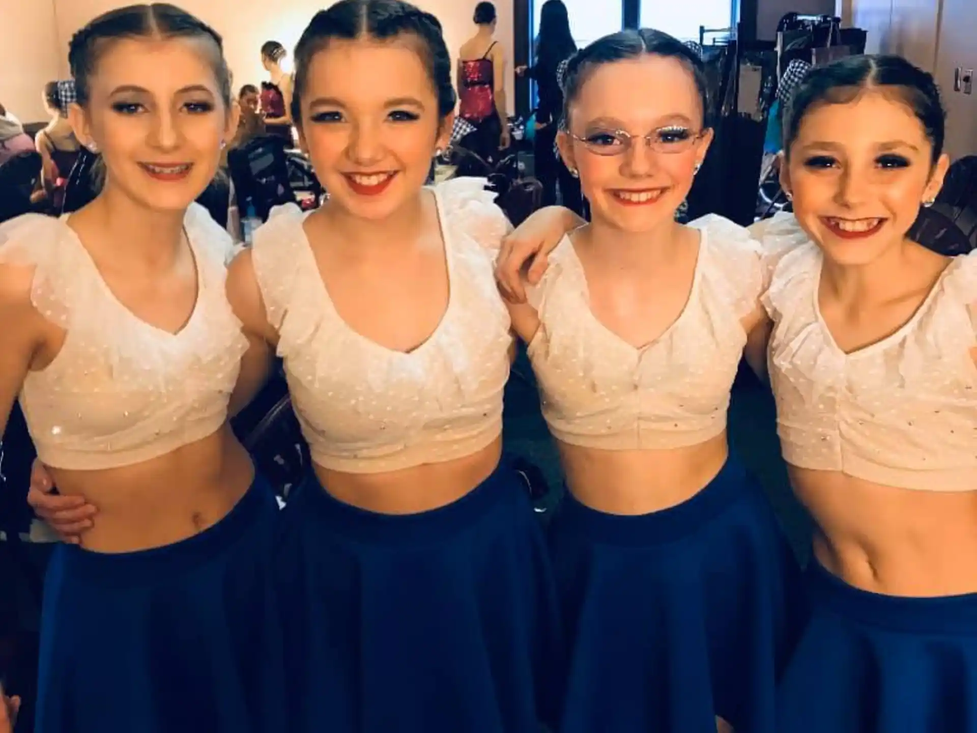 a group of girls posing for a photo