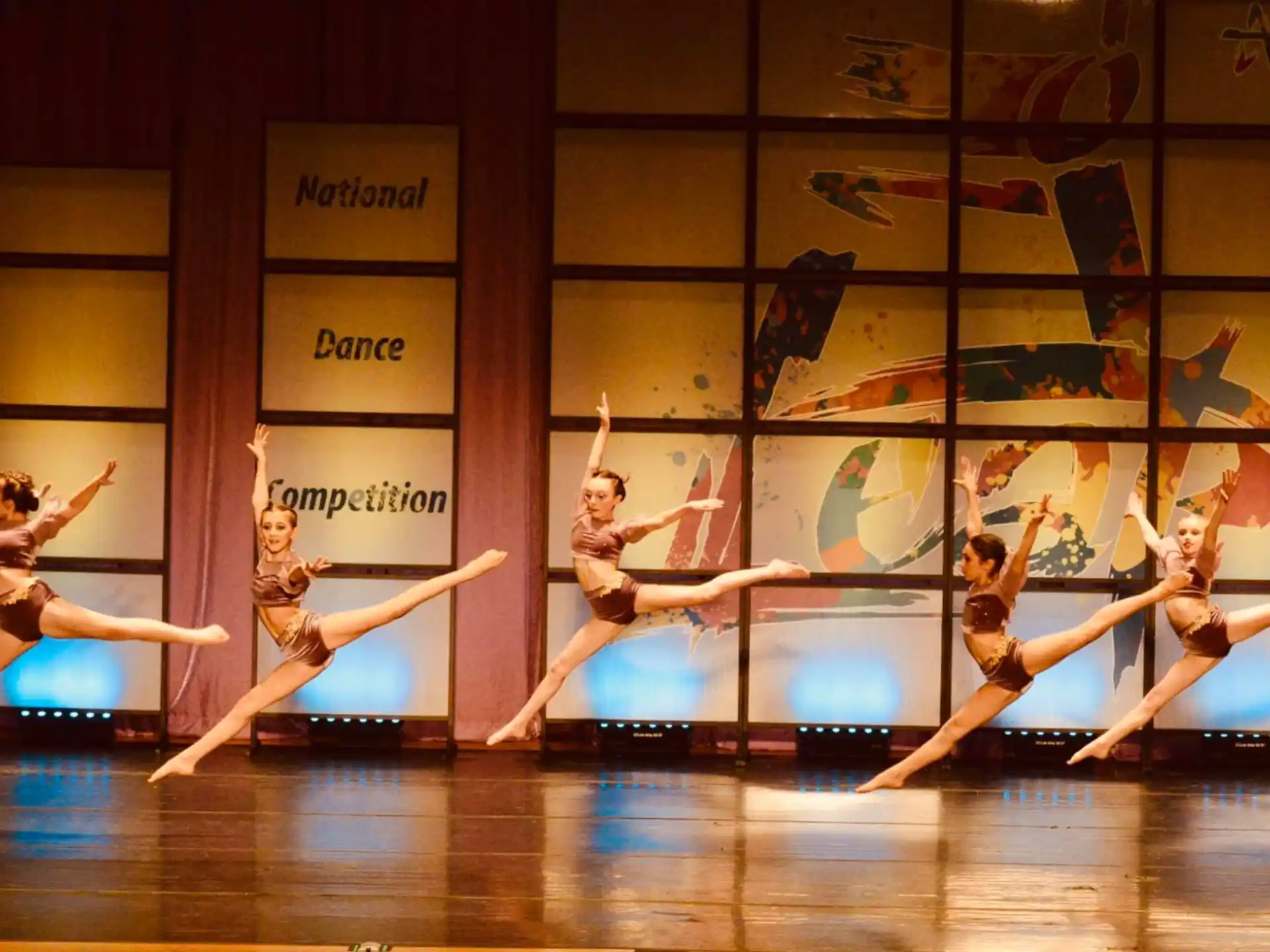 a group of women dancing on a stage