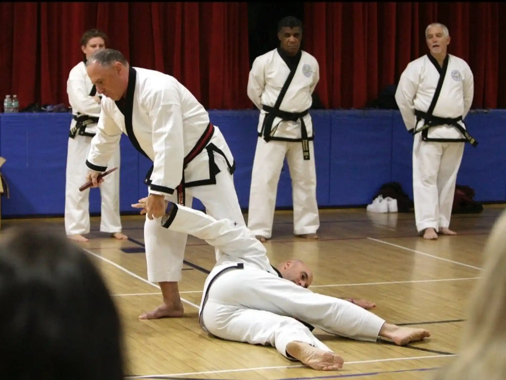a group of men in karate uniforms