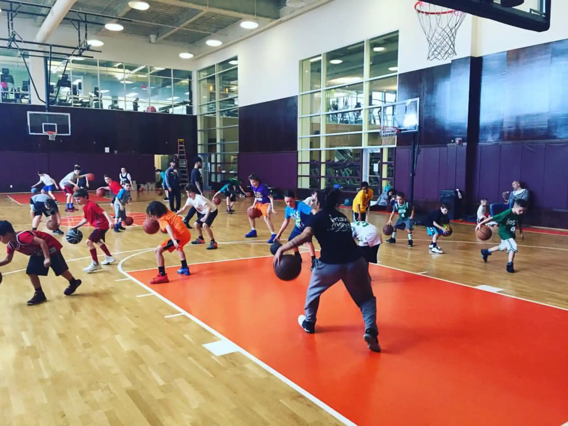 a group of people playing basketball