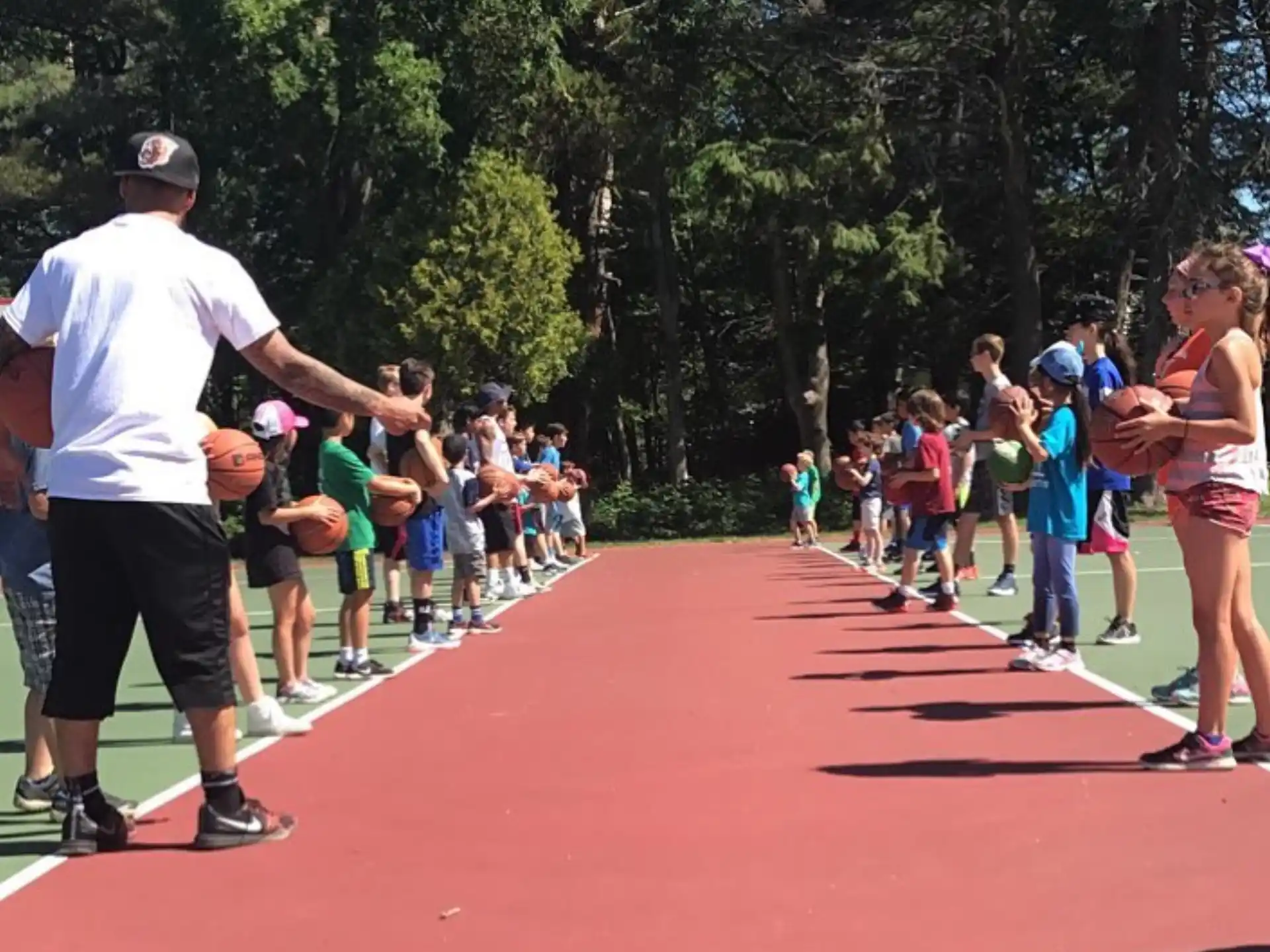 a group of people playing basketball