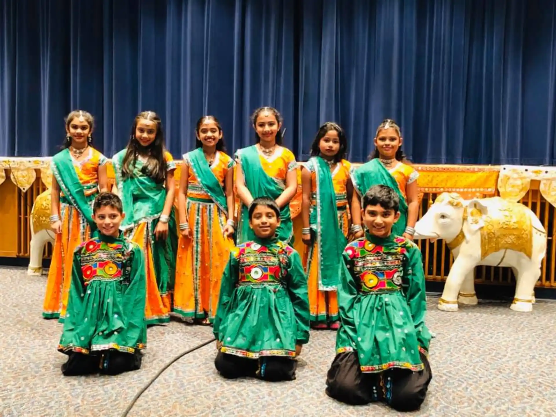 a group of people in colorful dresses