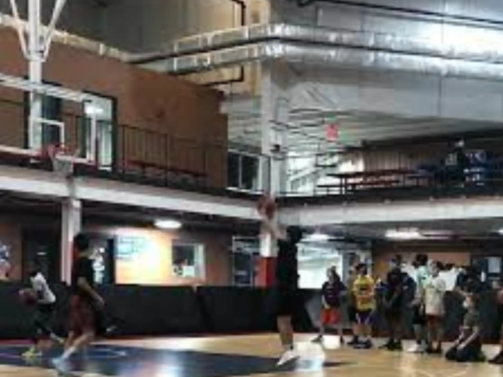 a group of people playing basketball