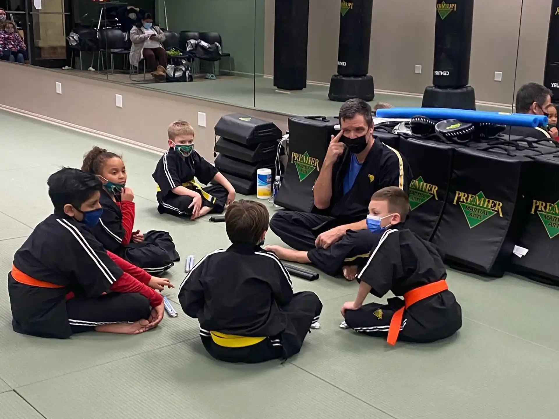 a group of people sitting on the floor