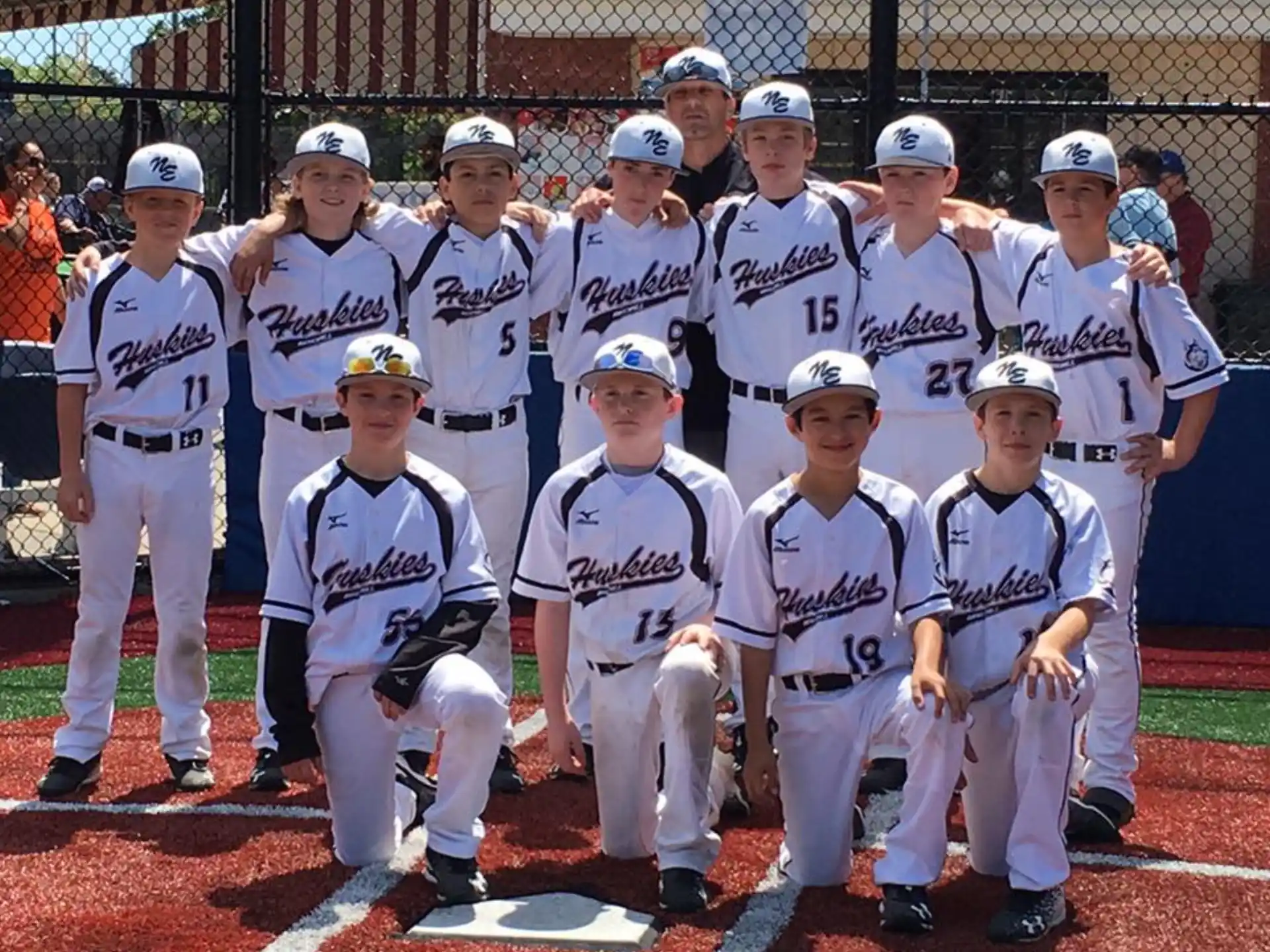 a group of baseball players posing for a photo