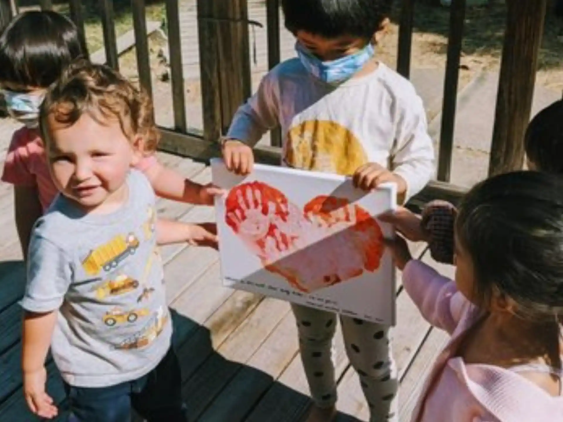 a group of children eating pizza
