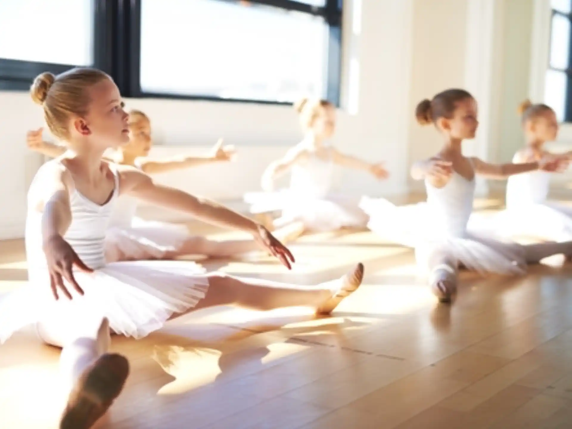 a group of children in white karate uniforms