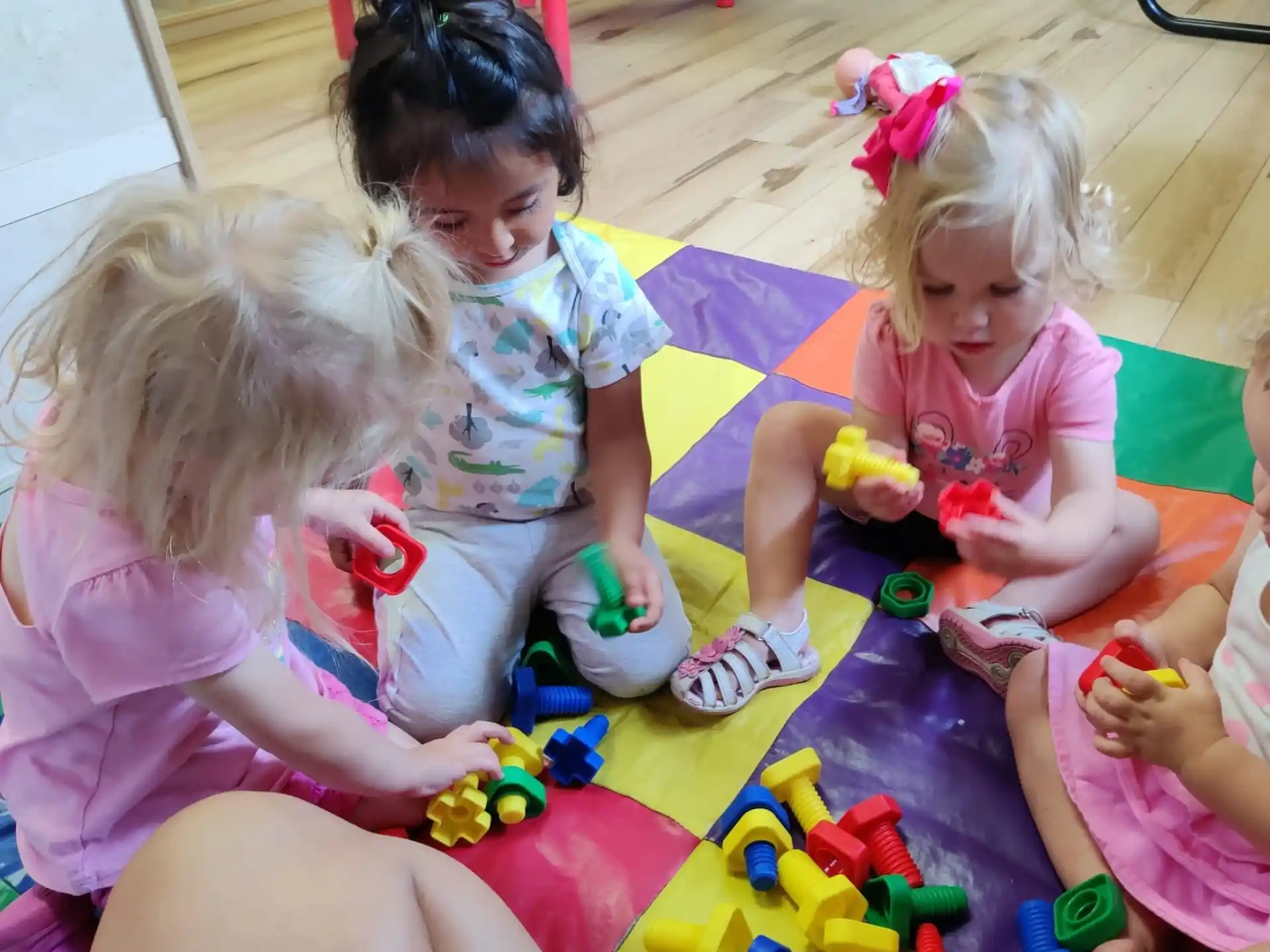a group of children playing with toys
