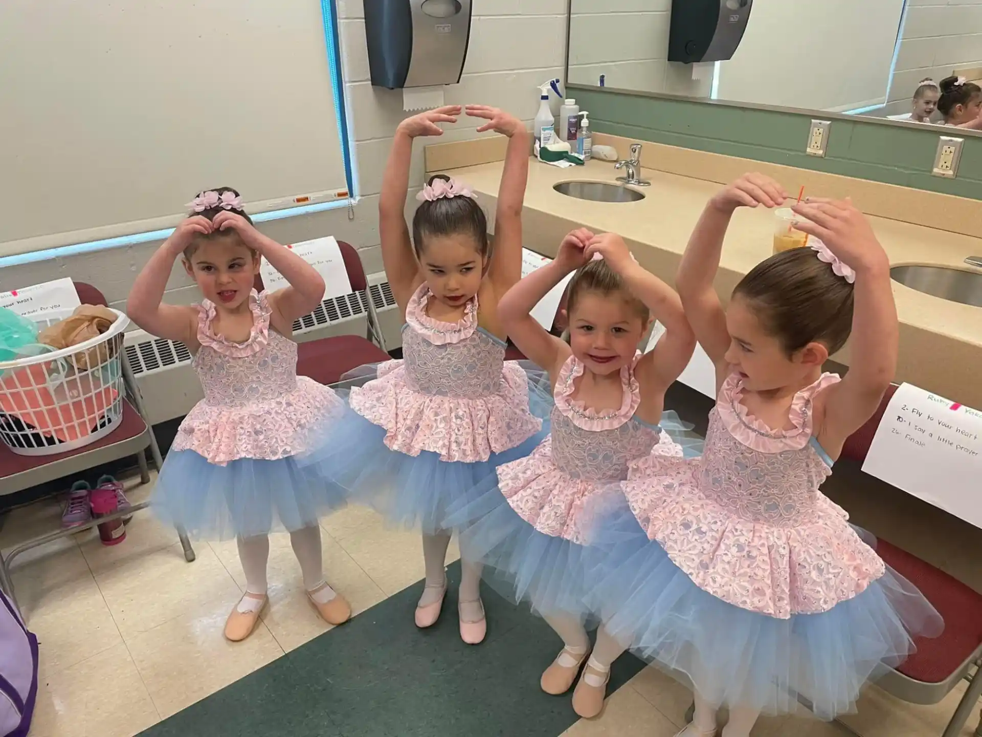 a group of girls in dresses