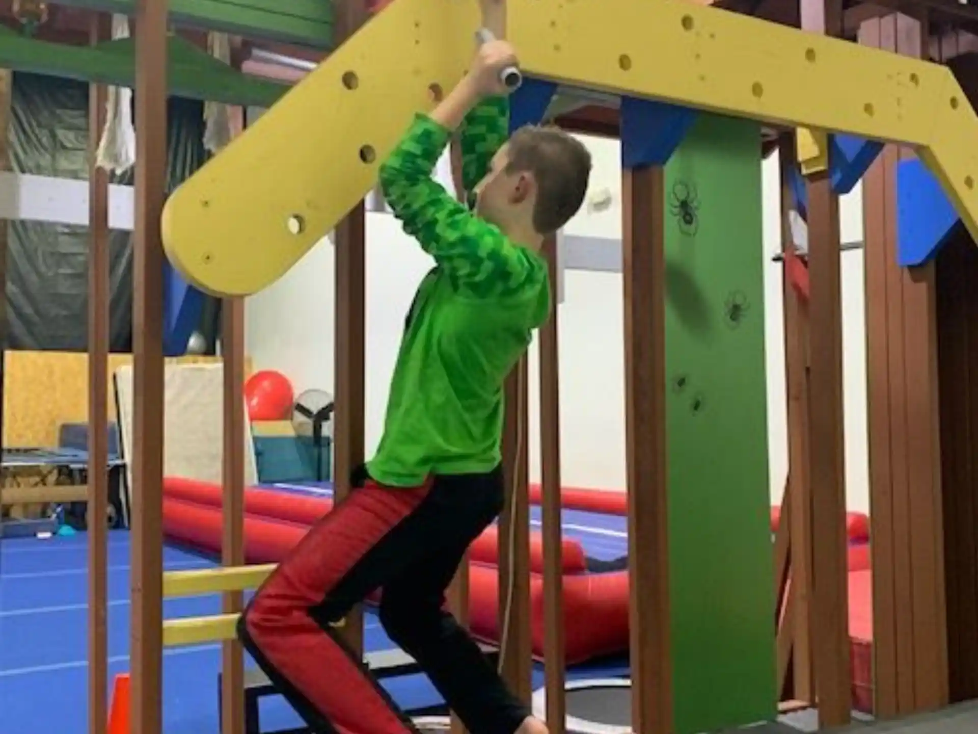 a boy climbing a slide