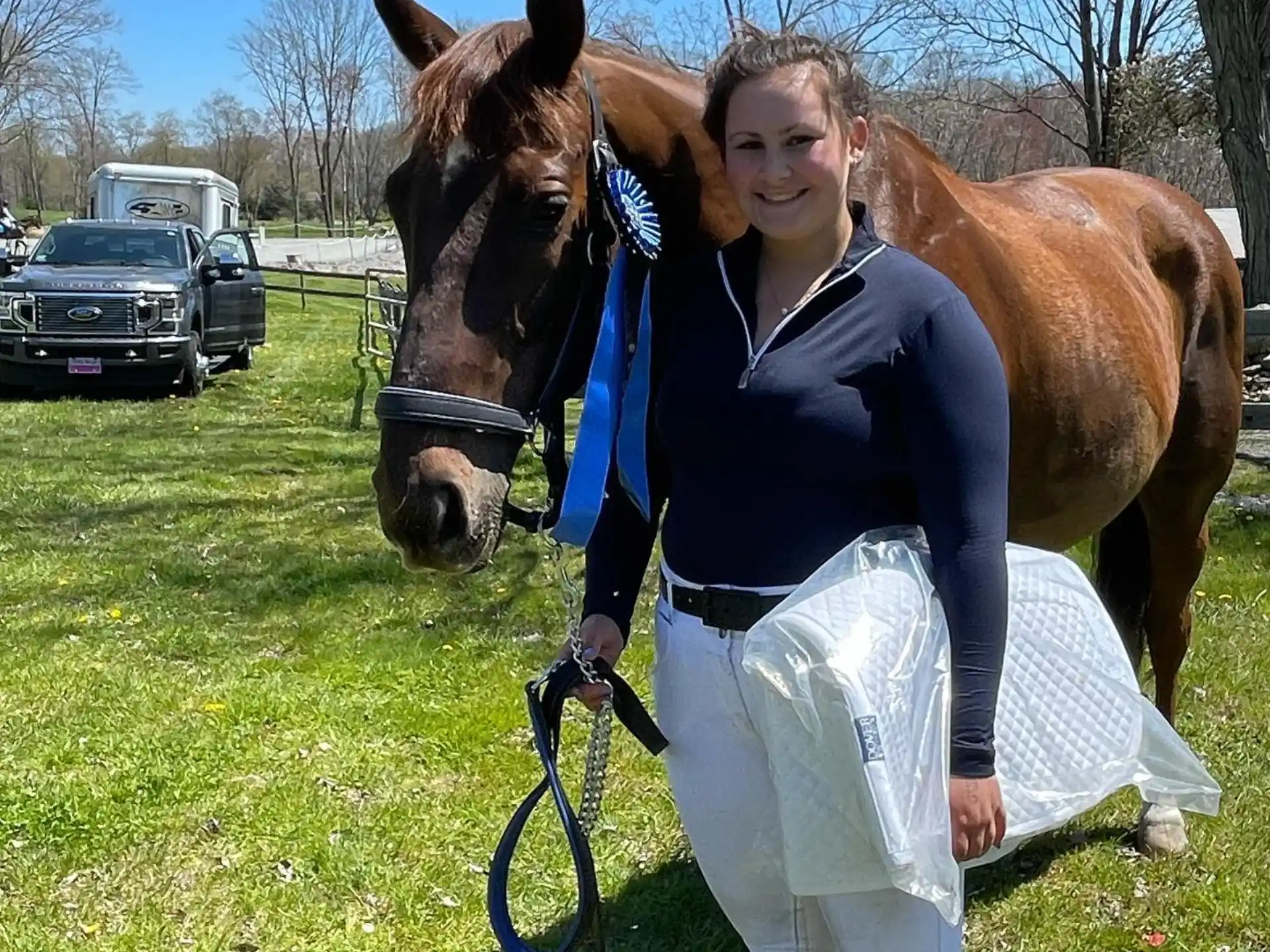 a woman holding a horse