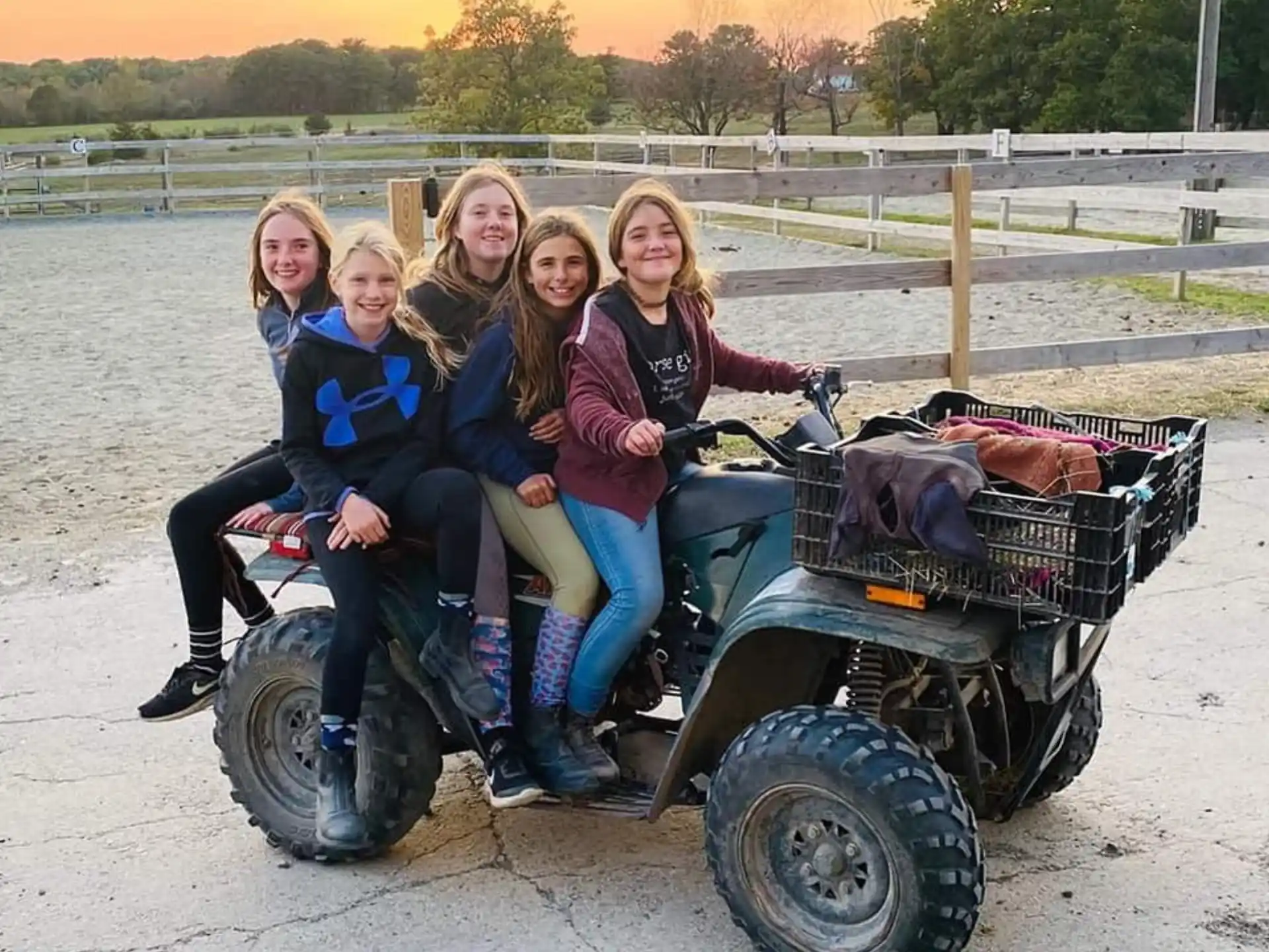 a group of people sitting on a vehicle