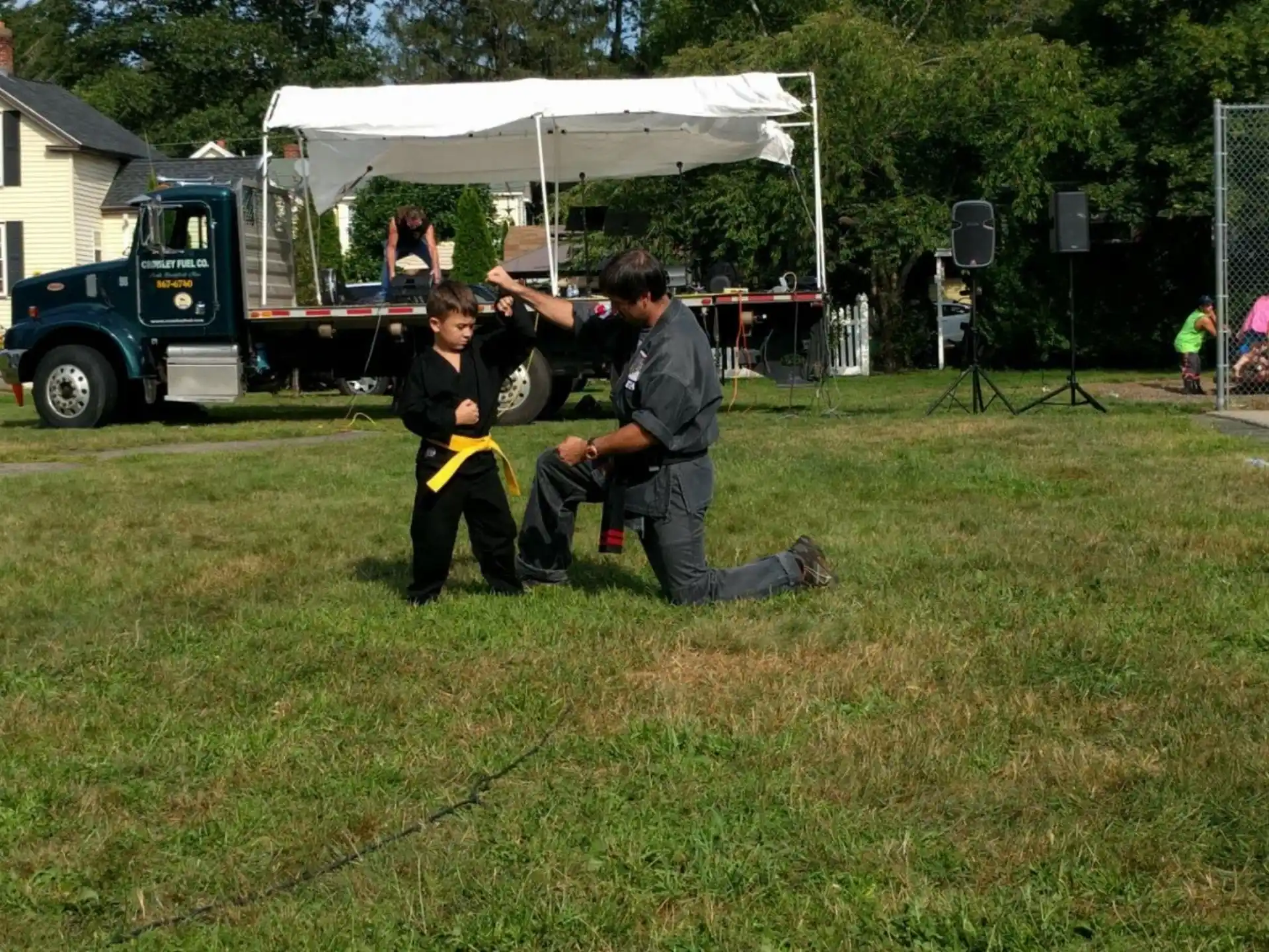 a man and a boy playing with a toy gun