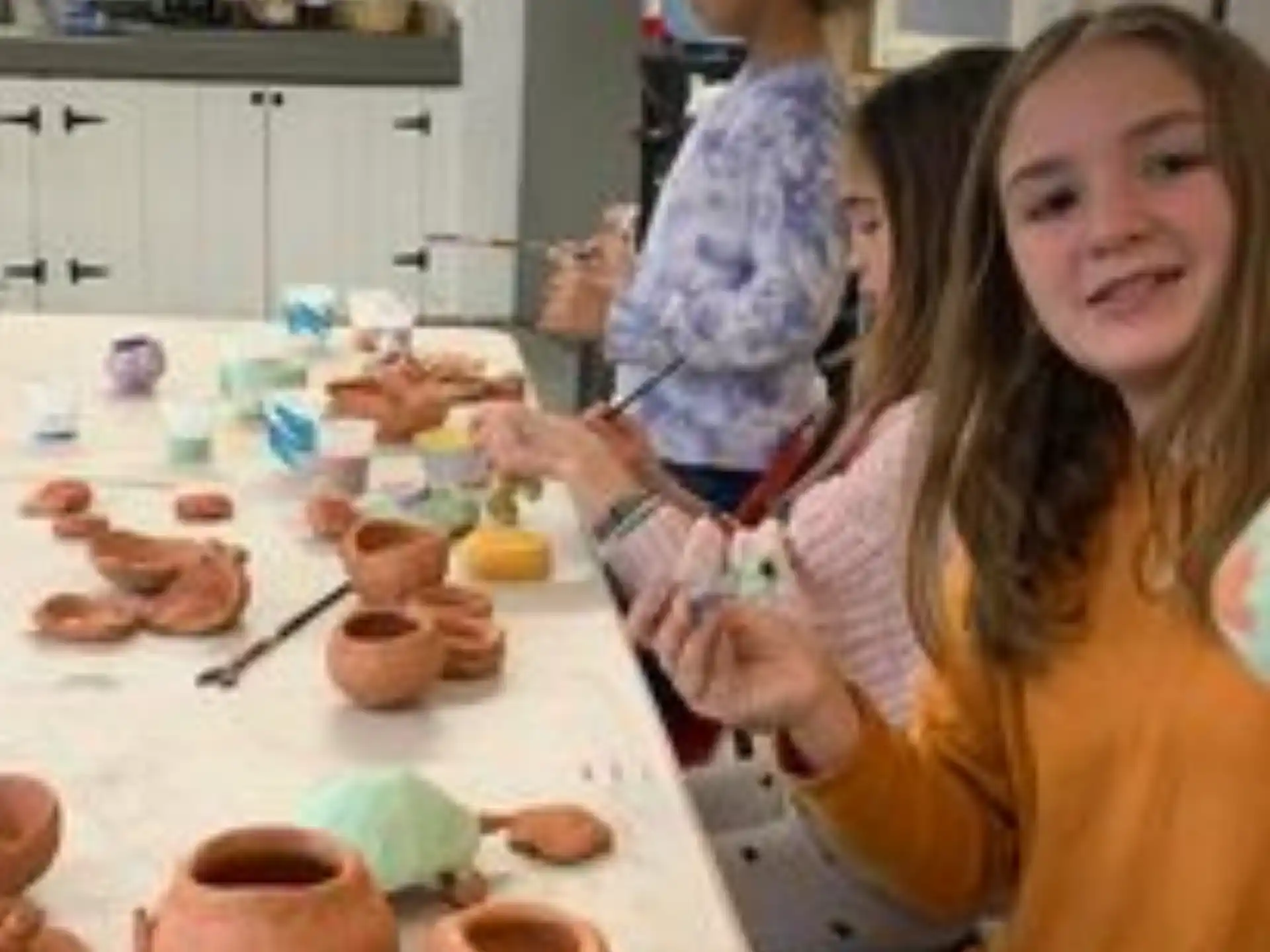 a person and a child in a kitchen
