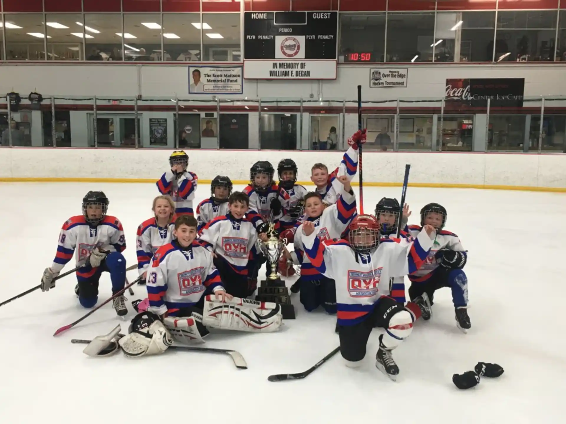a group of people in hockey uniforms on ice