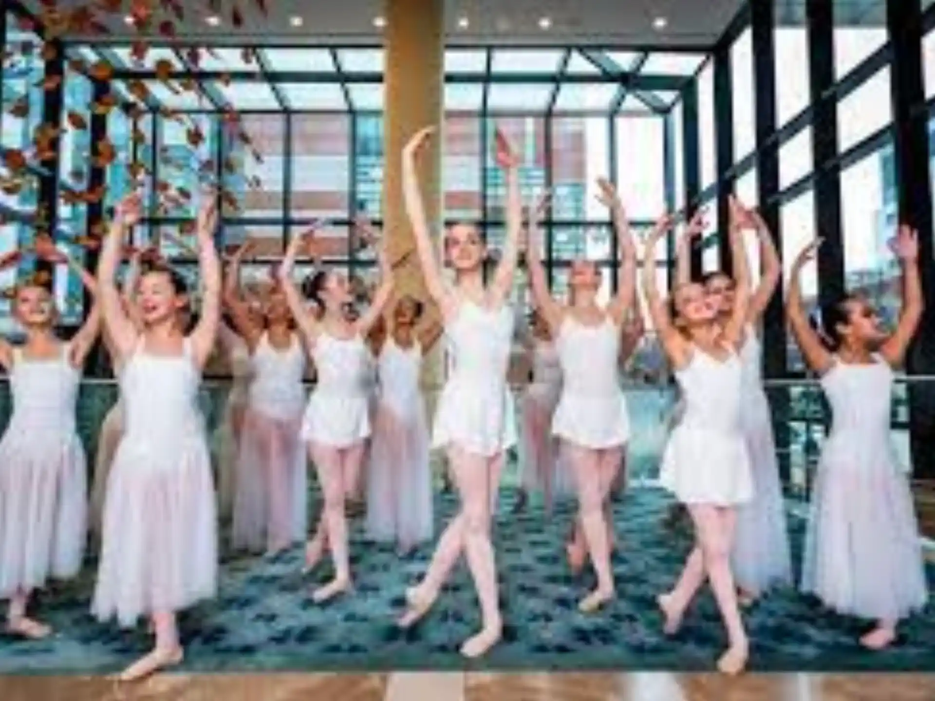 a group of girls in white dresses