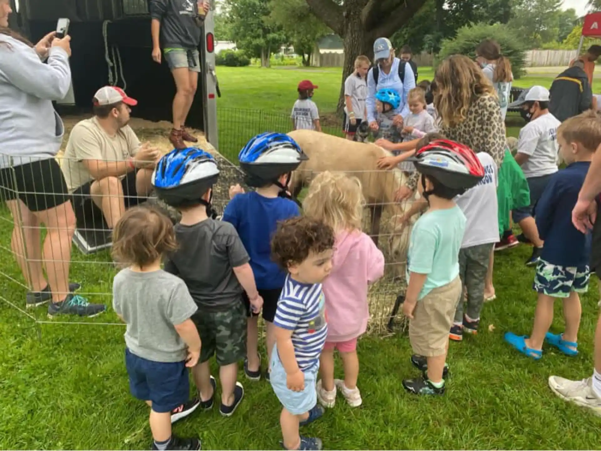 a group of kids wearing helmets