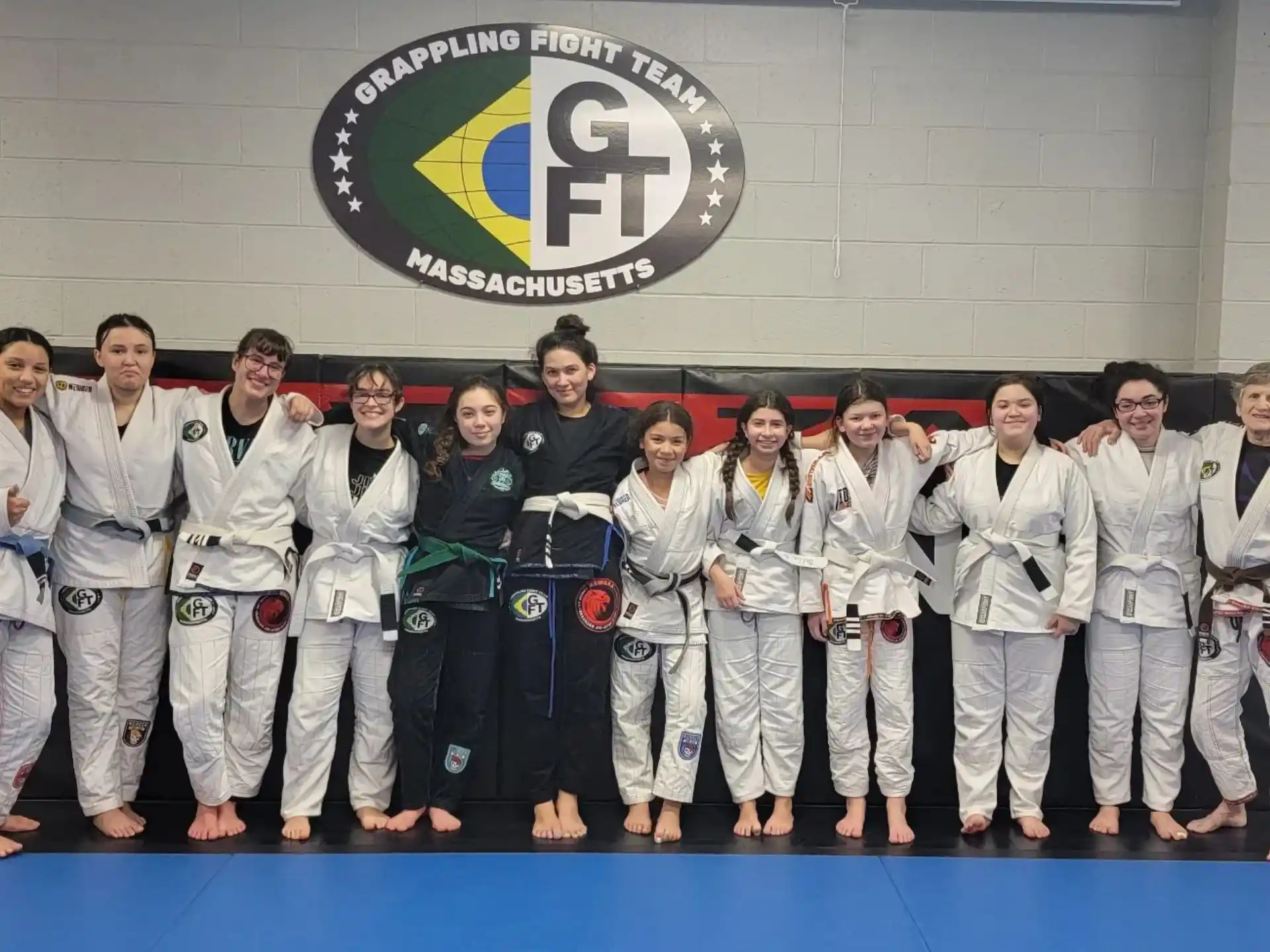 a group of people in karate uniforms