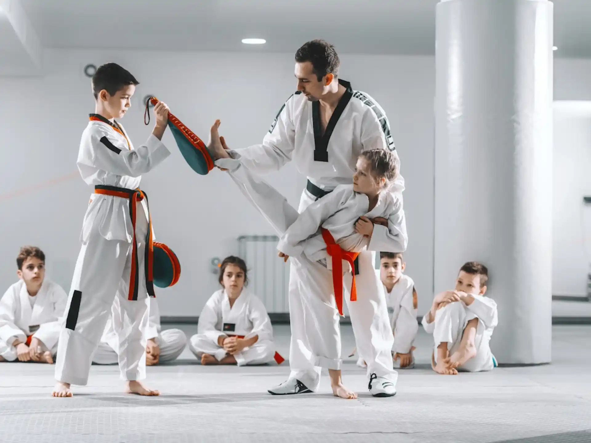 a group of people in karate uniforms
