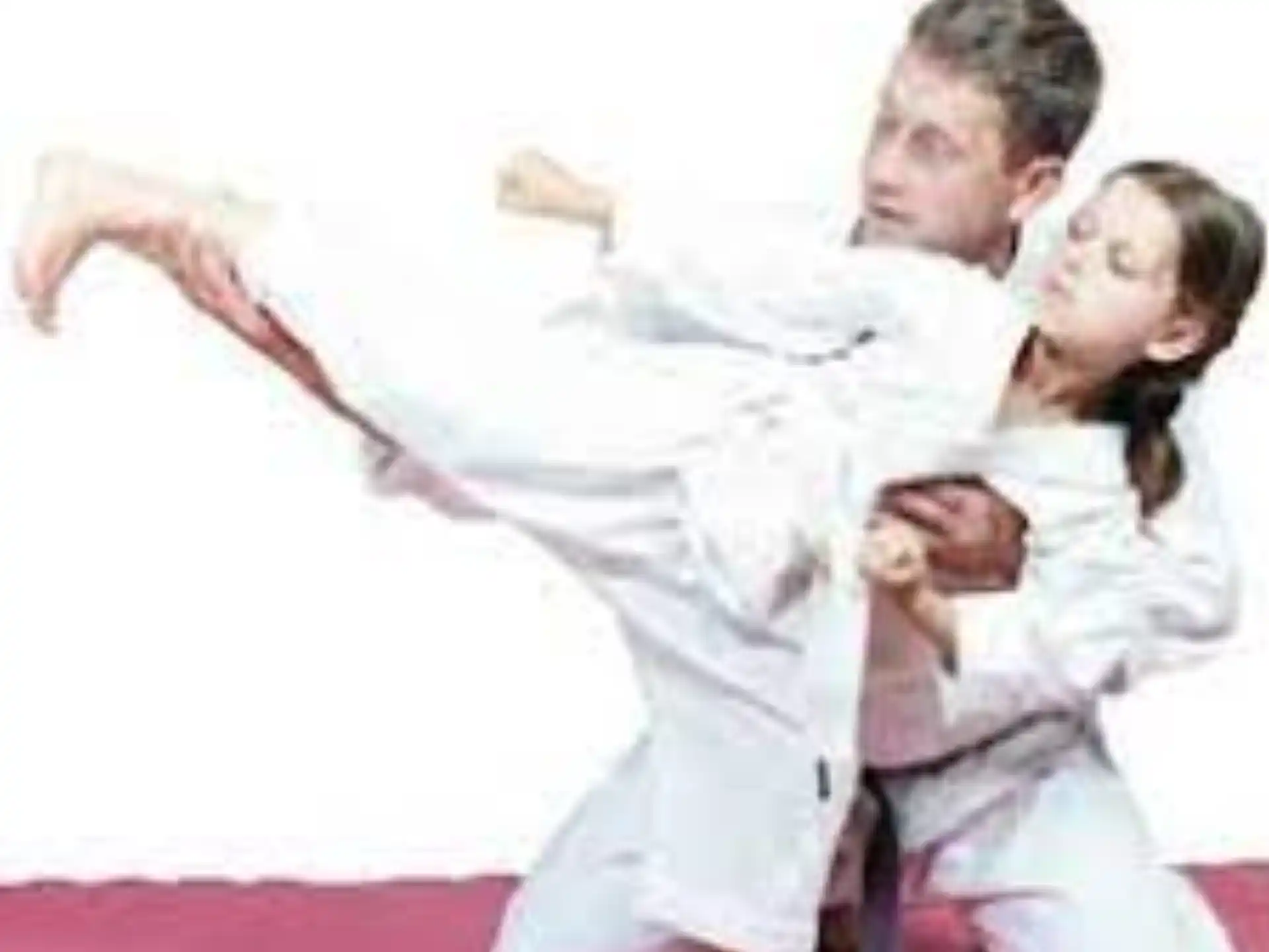 a man and a woman in karate uniforms