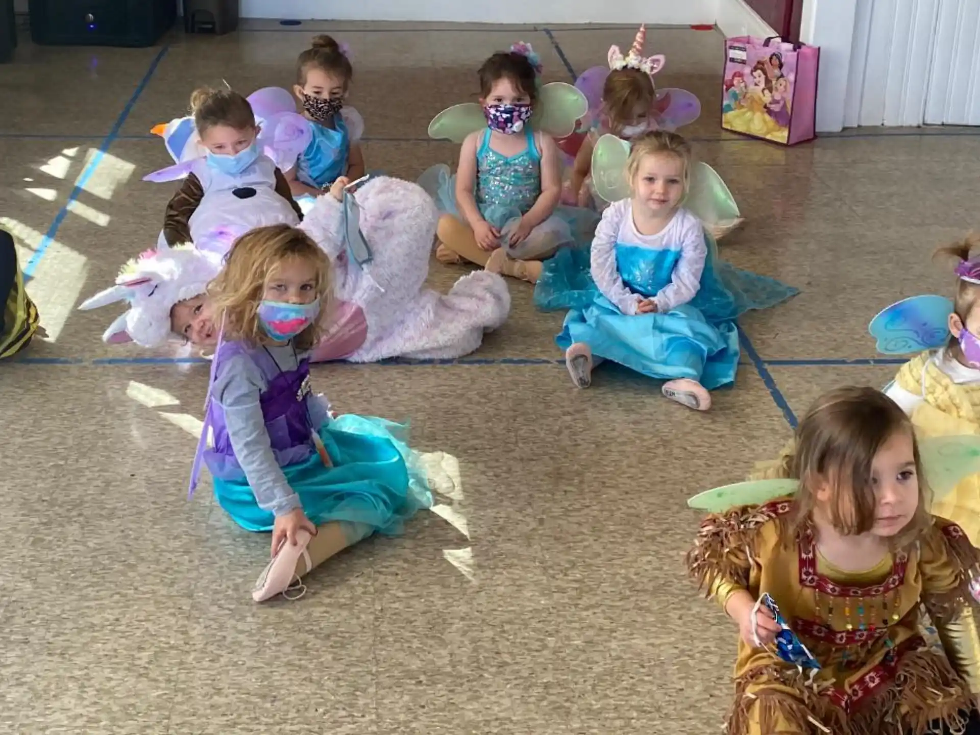a group of children sitting on the floor