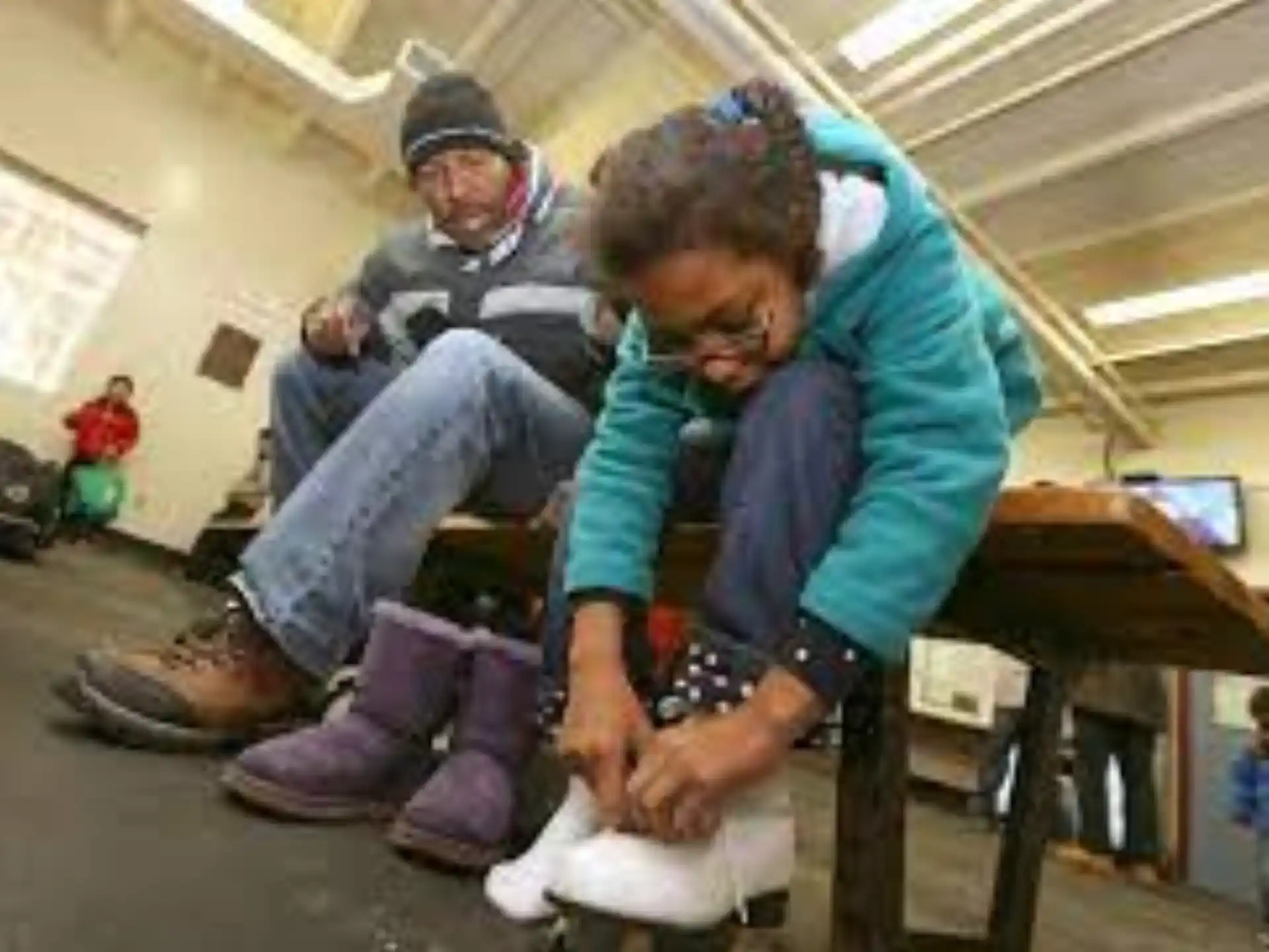 a man and a woman sitting on a chair