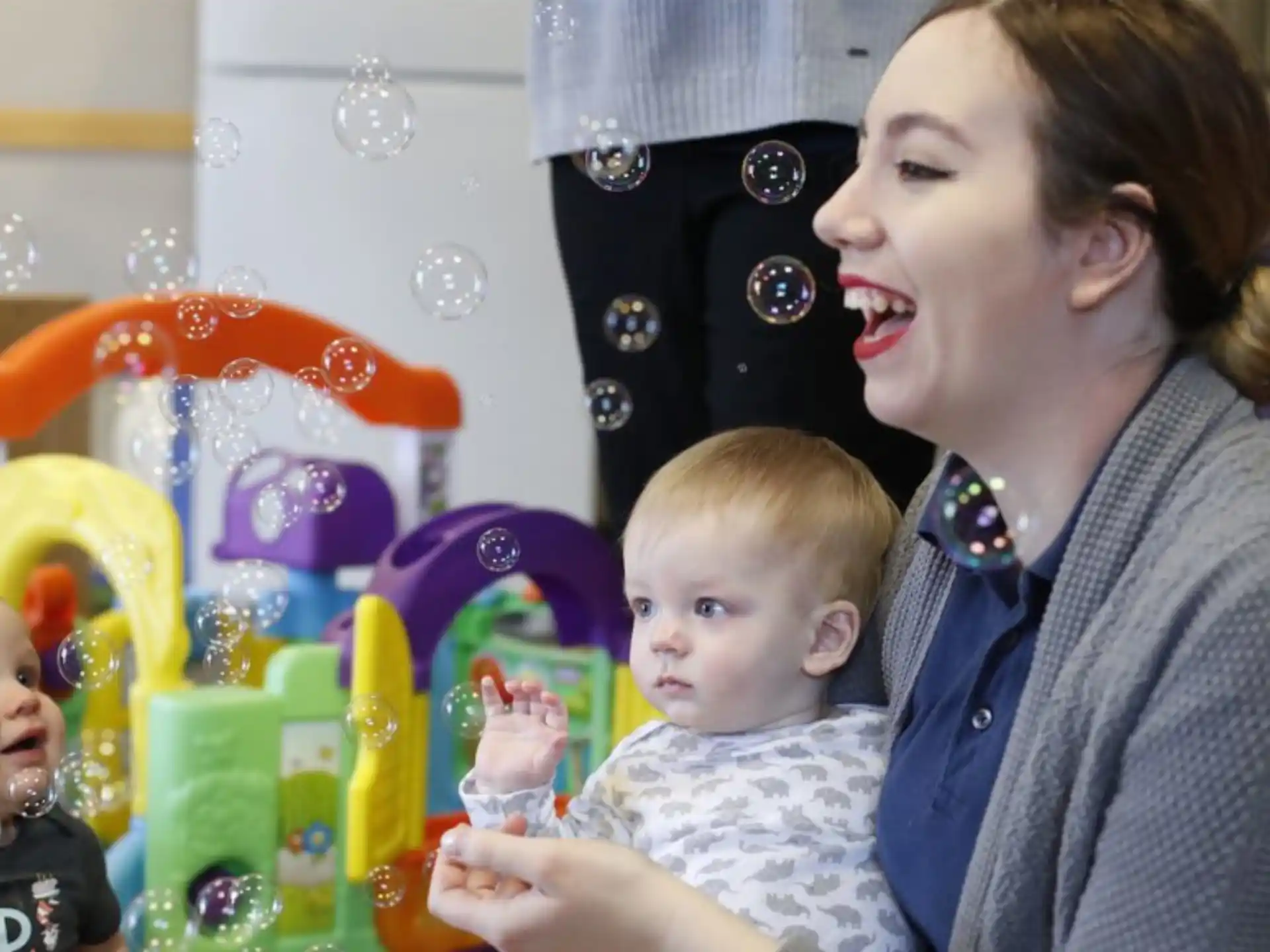 a person holding a baby