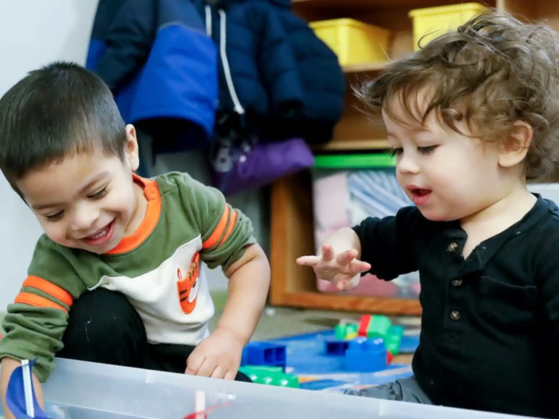 a couple of kids playing with toys