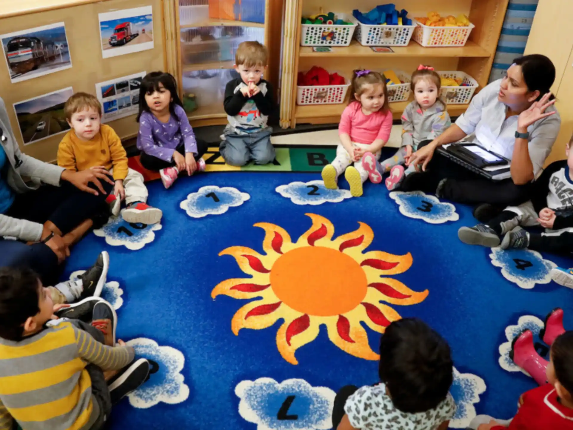 a group of children sitting on the floor