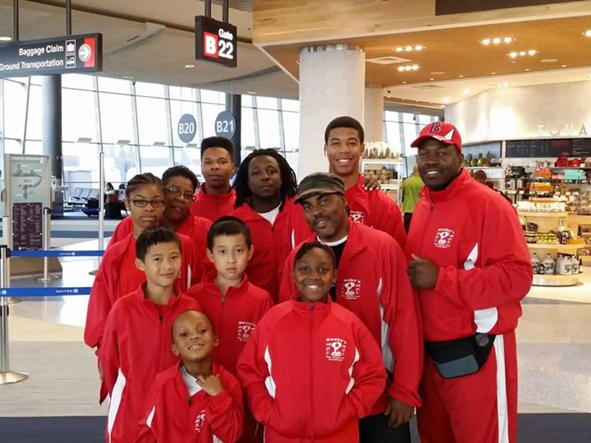 a group of people in red uniforms