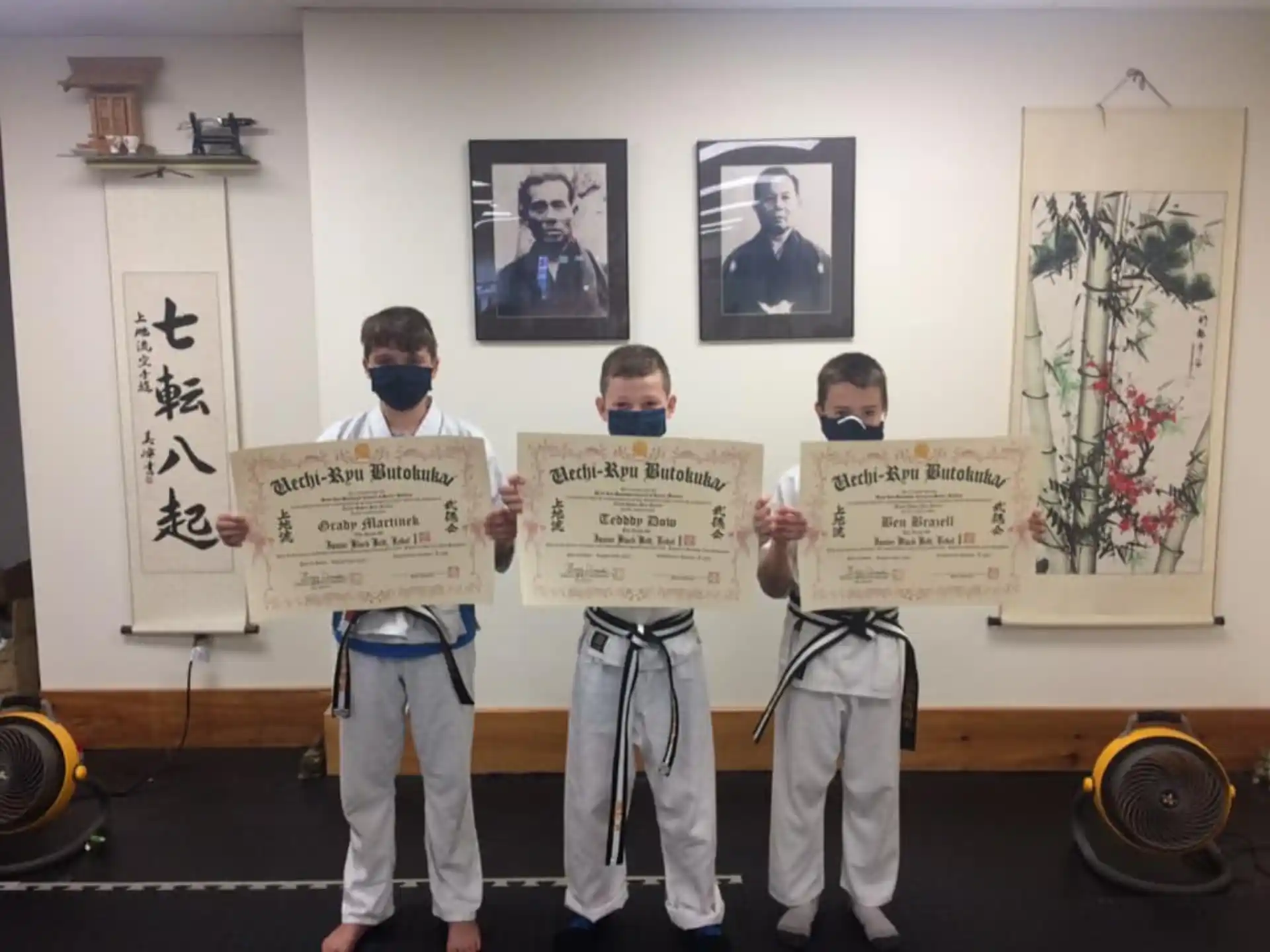 a group of men holding up posters