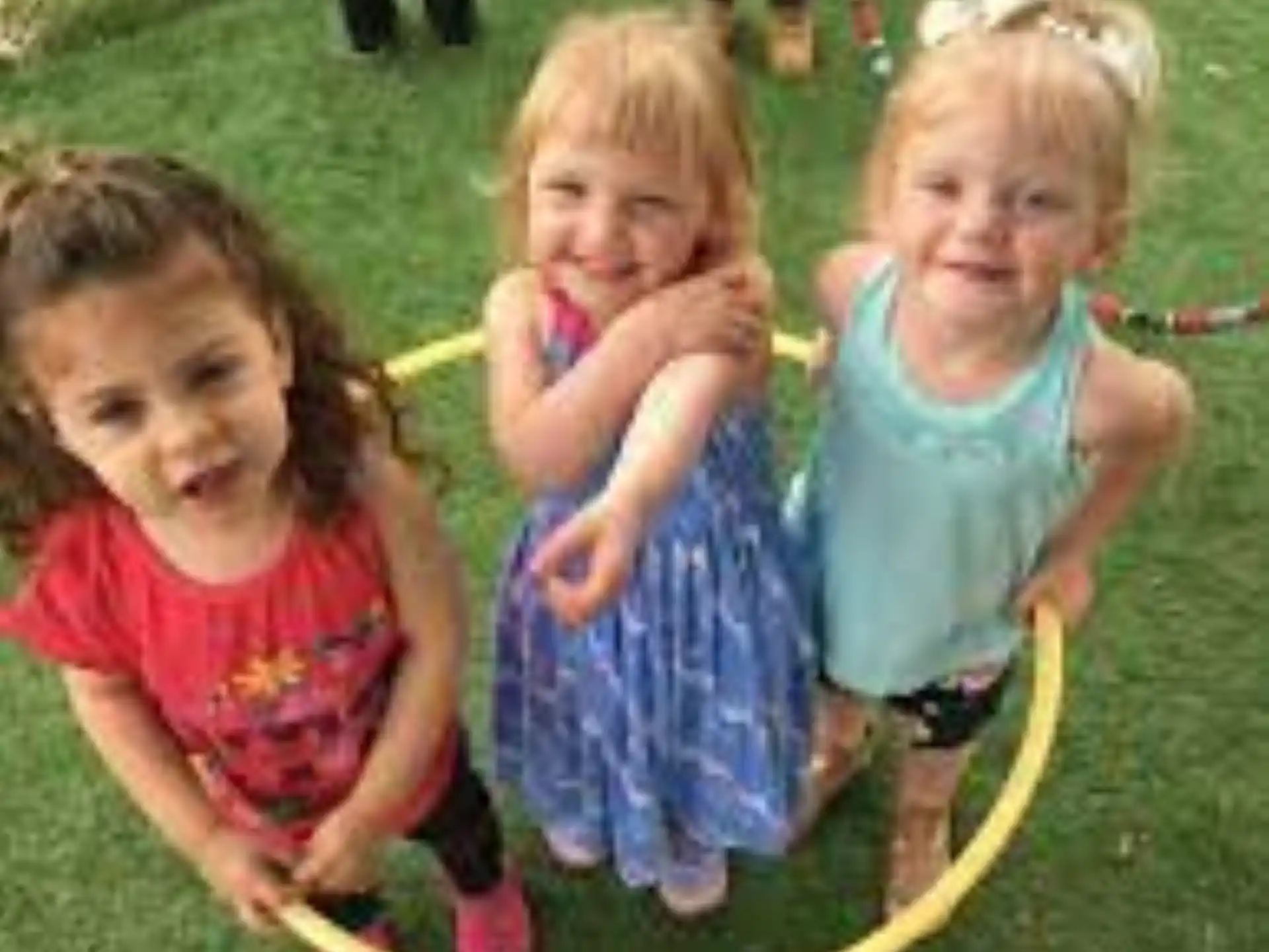 a group of girls playing in a yard