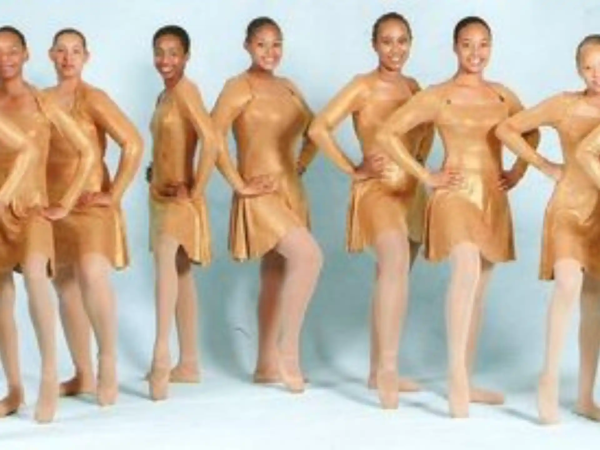 a group of men in gold