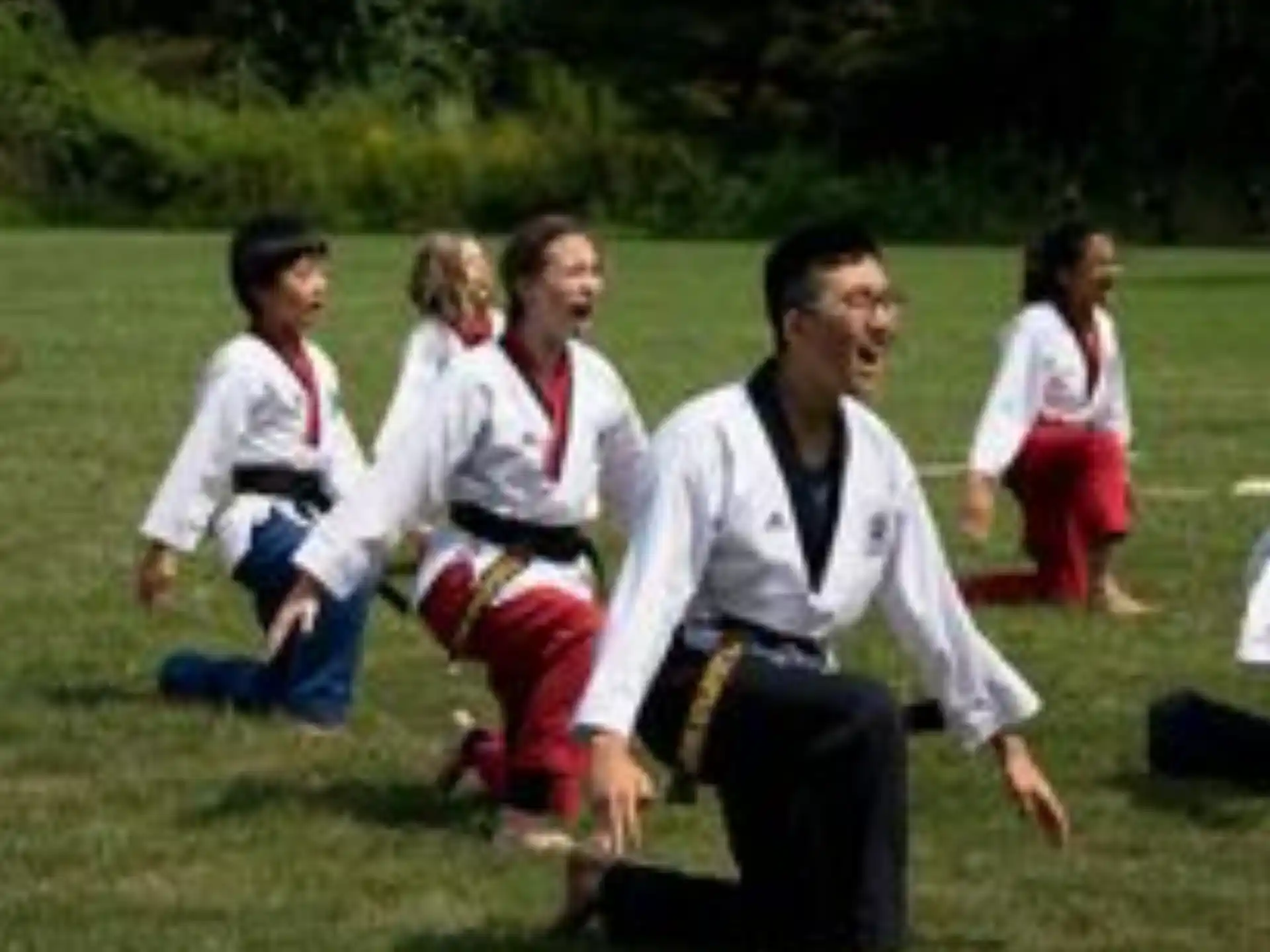 a group of people in karate uniforms